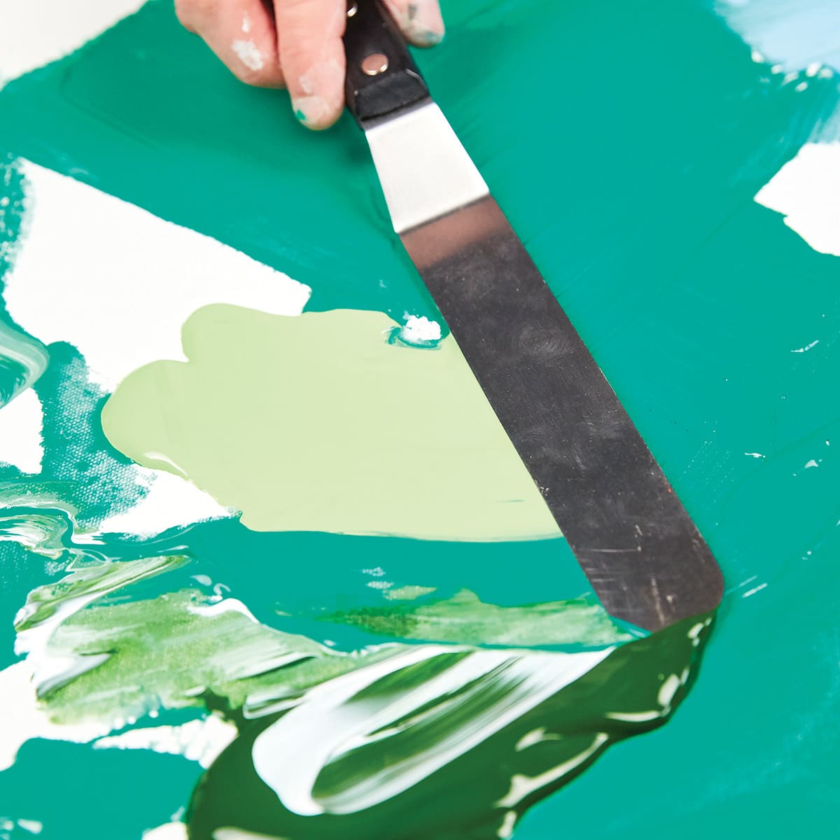 Liquitex Professional Soft Body Acrylic Paint (Paint being spread with palette knife) Liquitex Professional Soft Body Acrylic Paint (Paint being spread with palette knife)