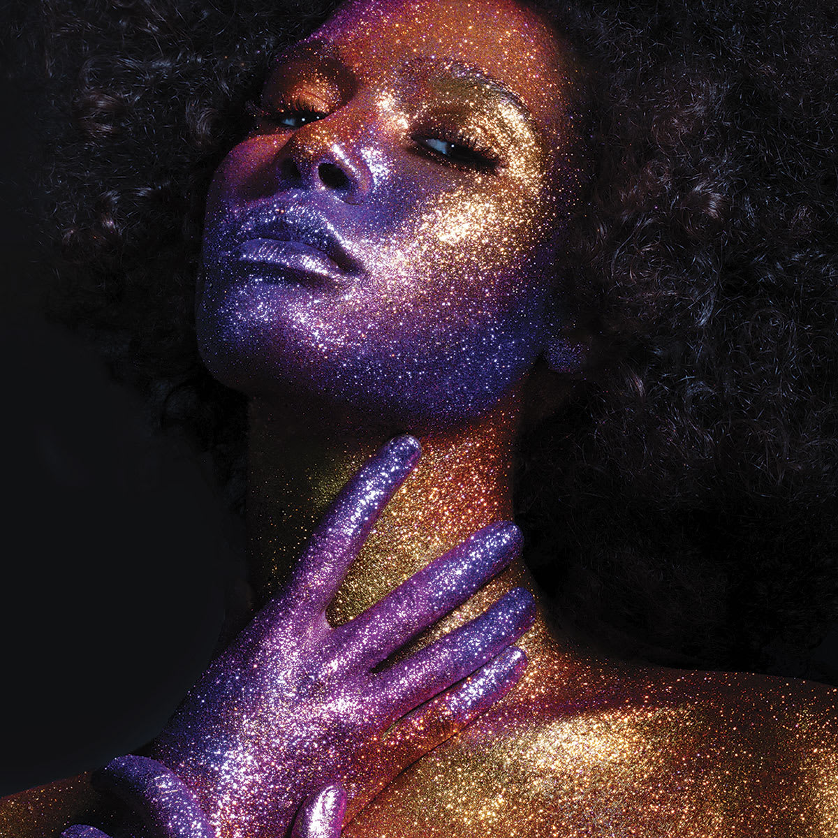 GlitterGlam Liquid Skin Sparkle - Woman's face and hands covered in sparkle