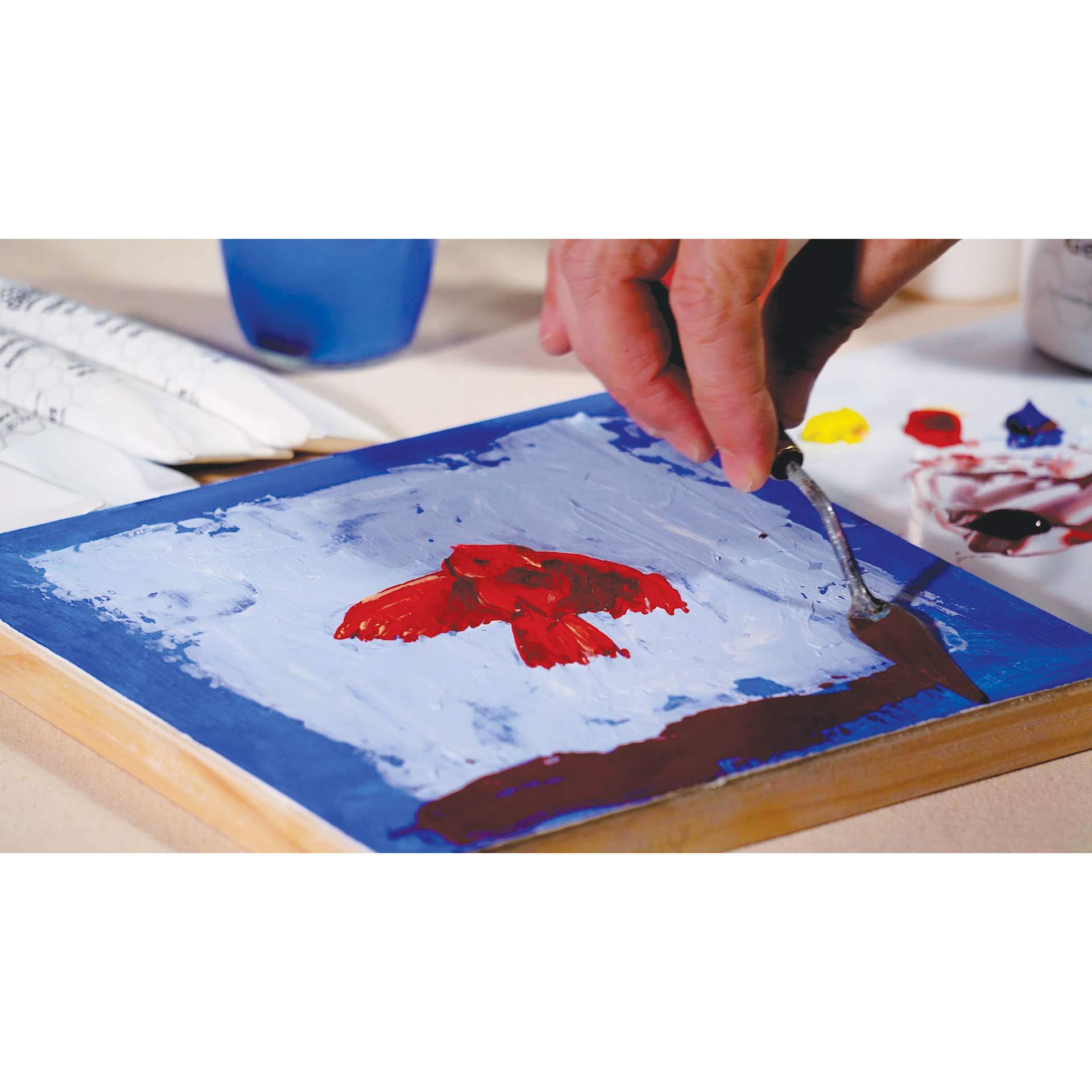 Ceracolors Waterborne Wax Paint, paint knife applying wax paint to wooden panel