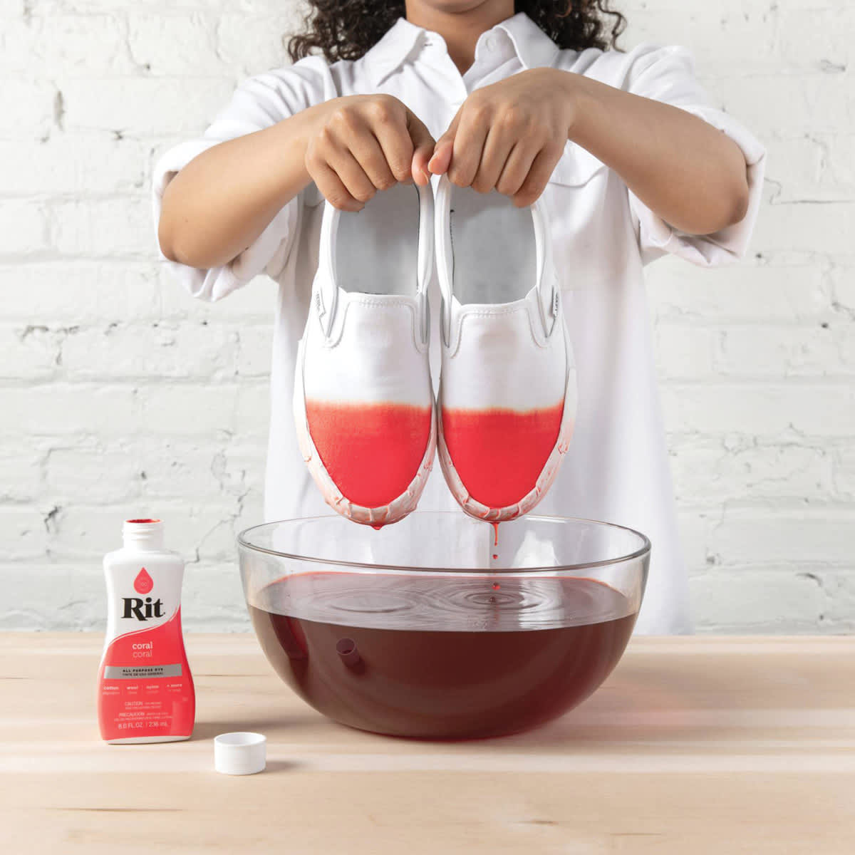 Rit All Purpose Liquid Dye - Coral, 8 oz, submerging shoes in dyed water
