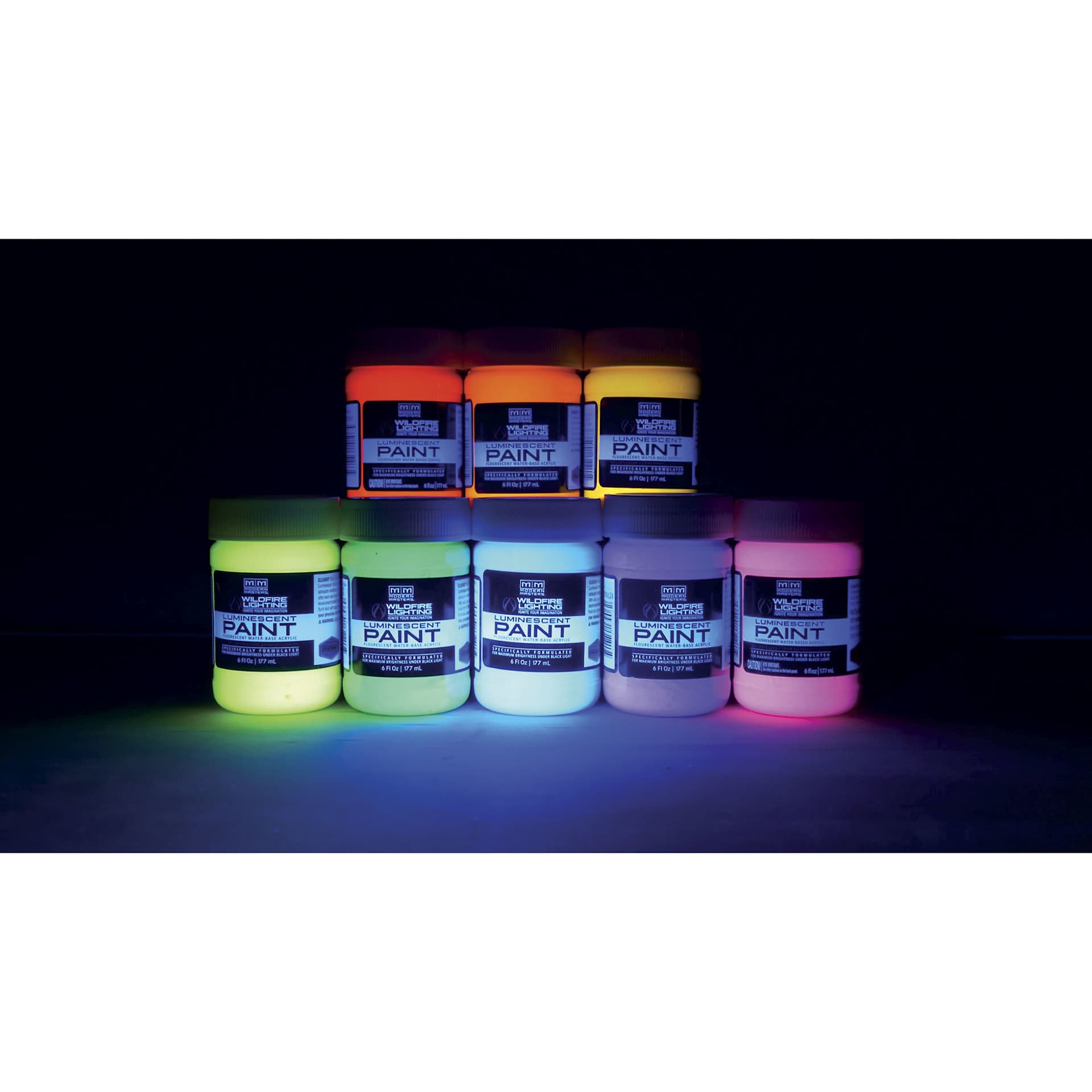 Wildfire Luminescent Fluorescent Acrylic Paints, in jars under blacklight