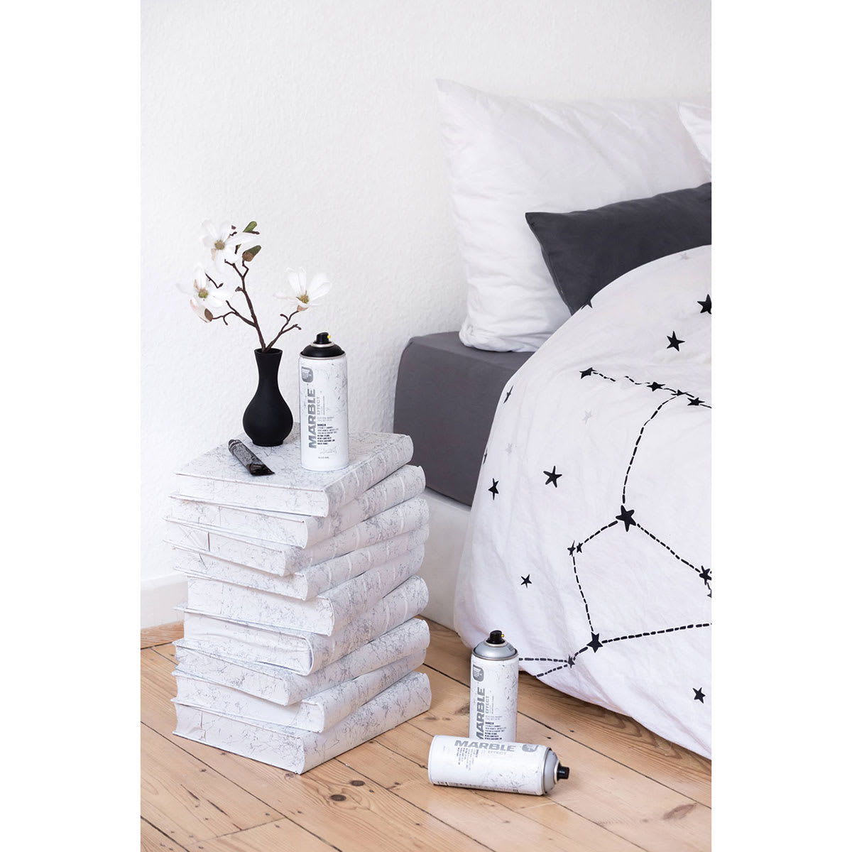 Nightstand made from books, painted with Montana Marble Effect Spray and shown in bedroom setting Nightstand made from books, painted with Montana Marble Effect Spray and shown in bedroom setting