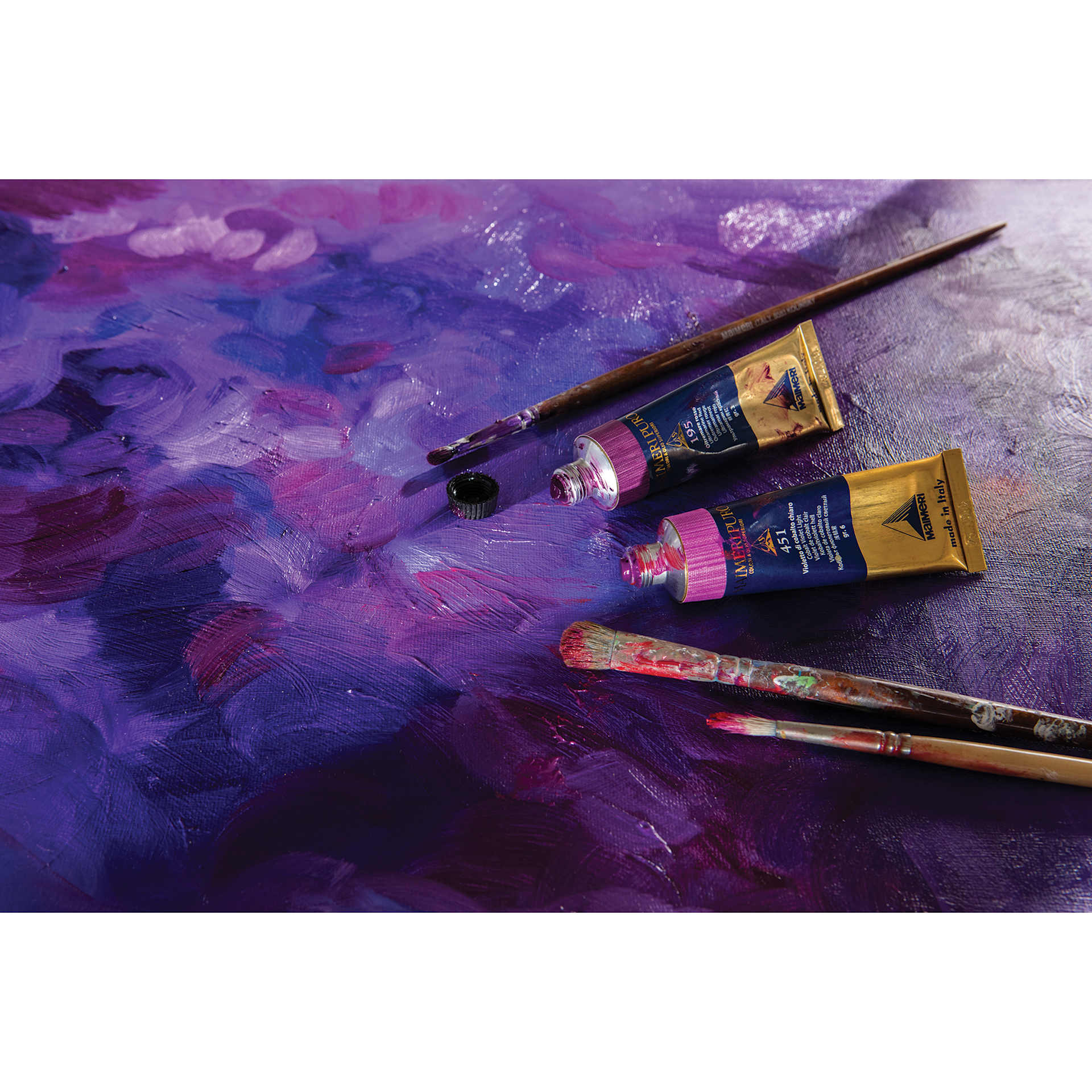 Maimeri Puro Oil Paints and brushes on a purple background. Maimeri Puro Oil Paints and brushes on a purple background.