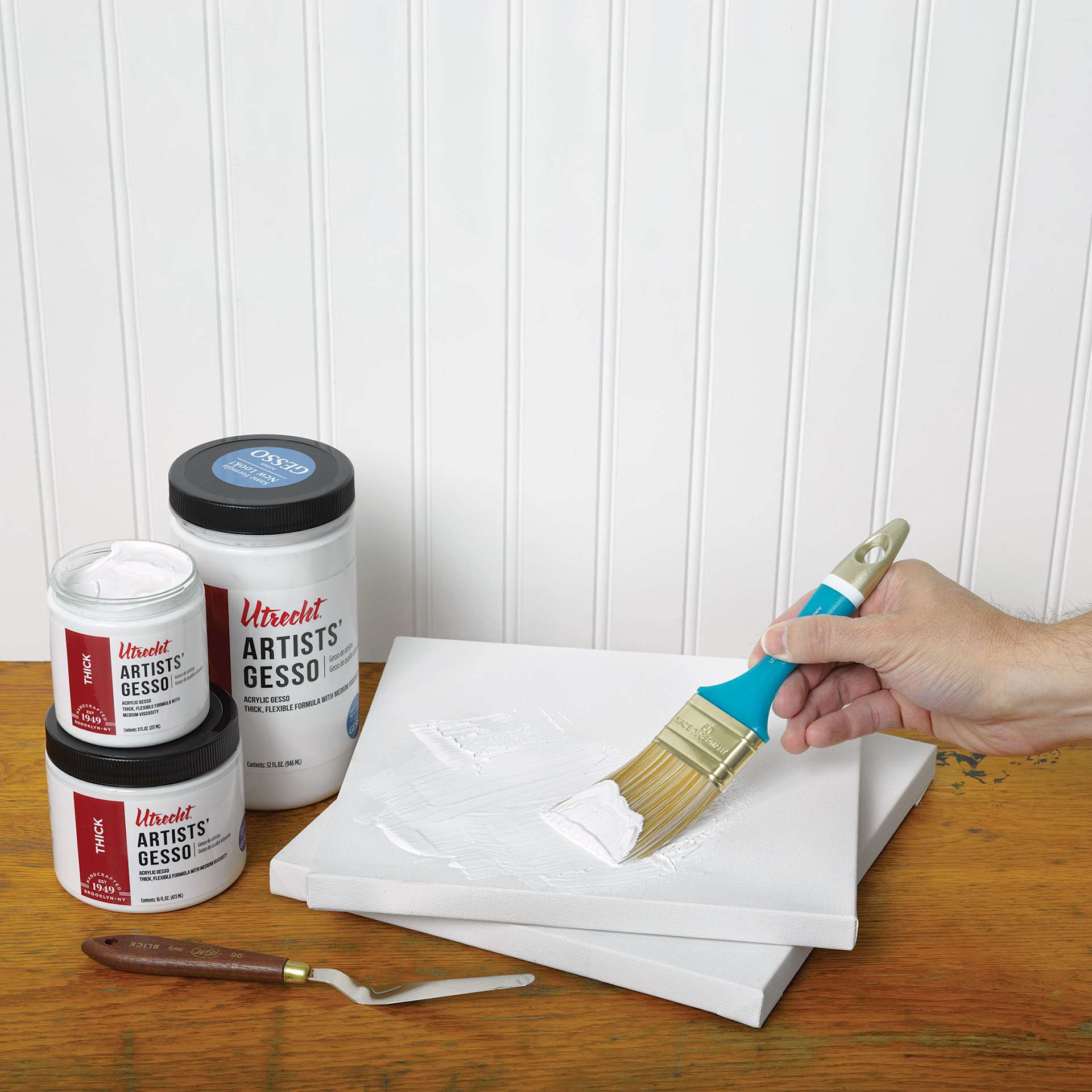 Utrecht Artists' Acrylic White Gesso being applied to a canvas with a brush. Utrecht Artists' Acrylic White Gesso being applied to a canvas with a brush.