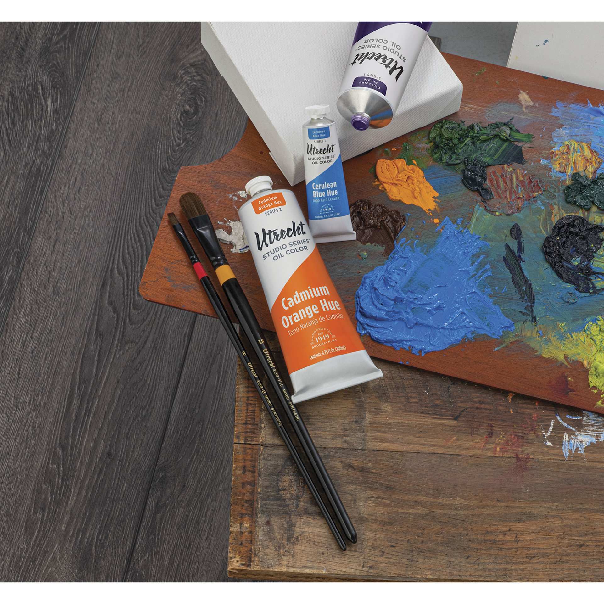 Utrecht Studio Series Oil Paints - tubes, brushes, and palette on desk