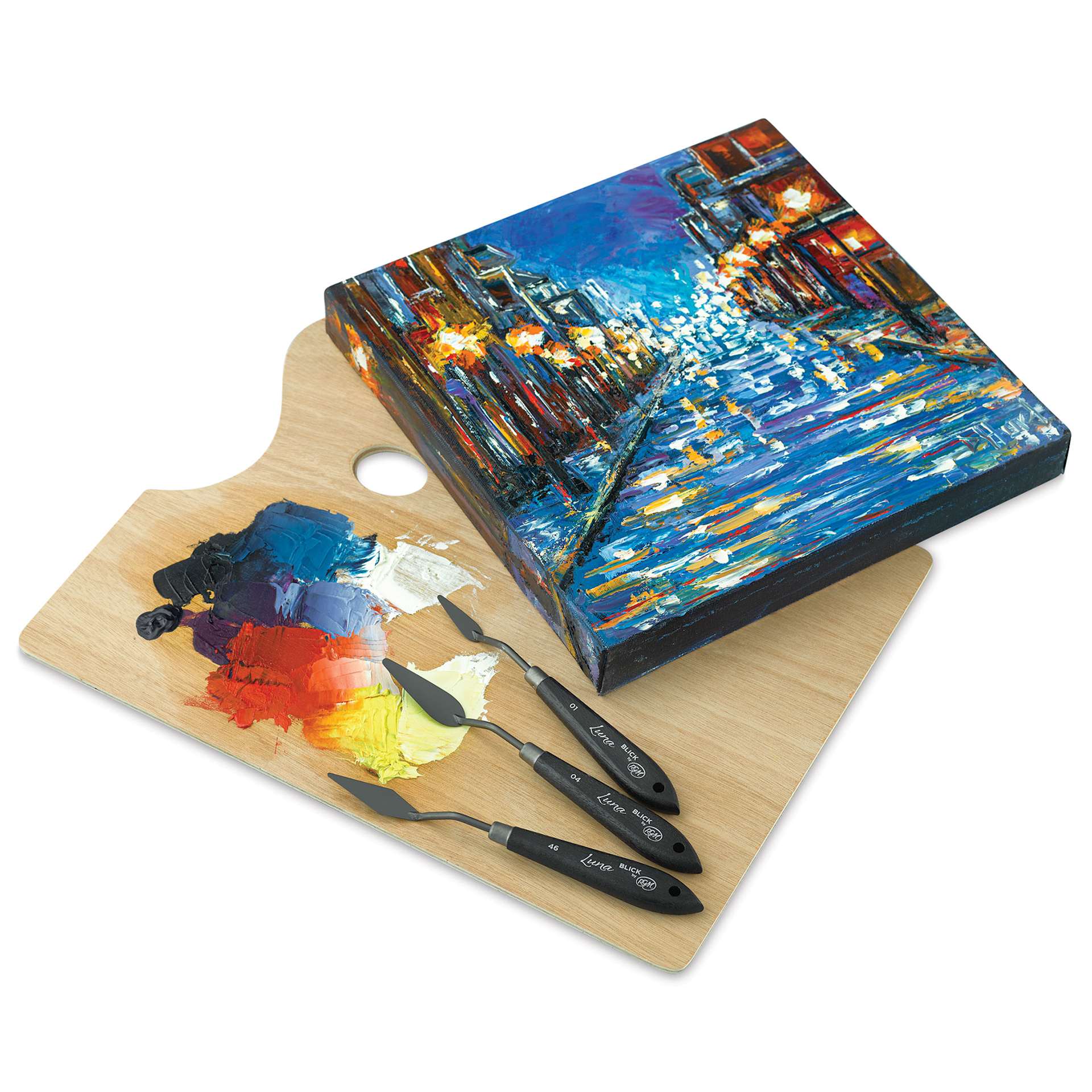 Blick Luna Palette Knife by RGM - knives on top of a painted palette next too finished painting Blick Luna Palette Knife by RGM - knives on top of a painted palette next too finished painting