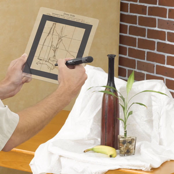 Compose It Grids - Artist using grid to sketch still life of a bottle, a plant, and a banana