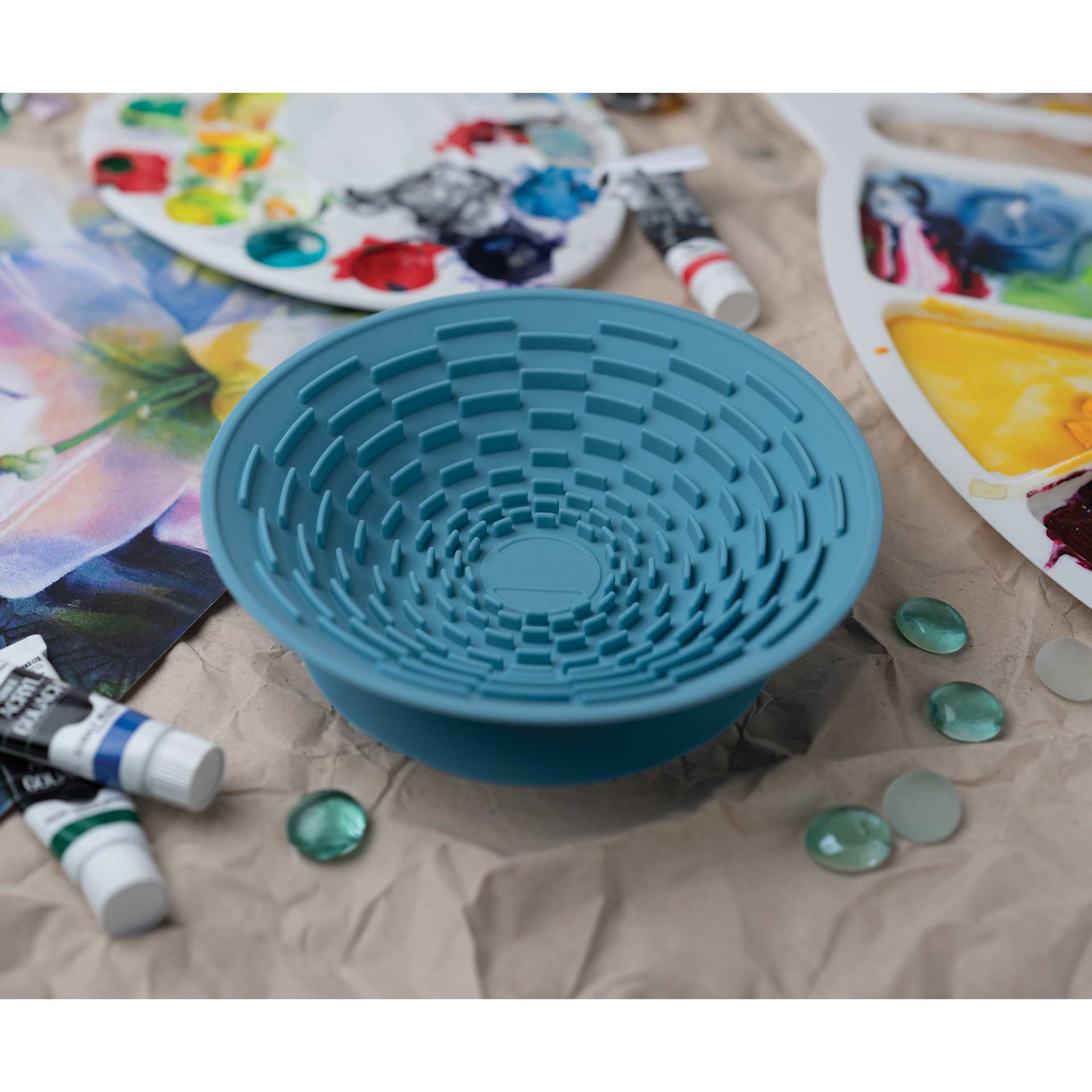 Silver Essentials Brush Cleaning Silicone Bowl on a studio table.