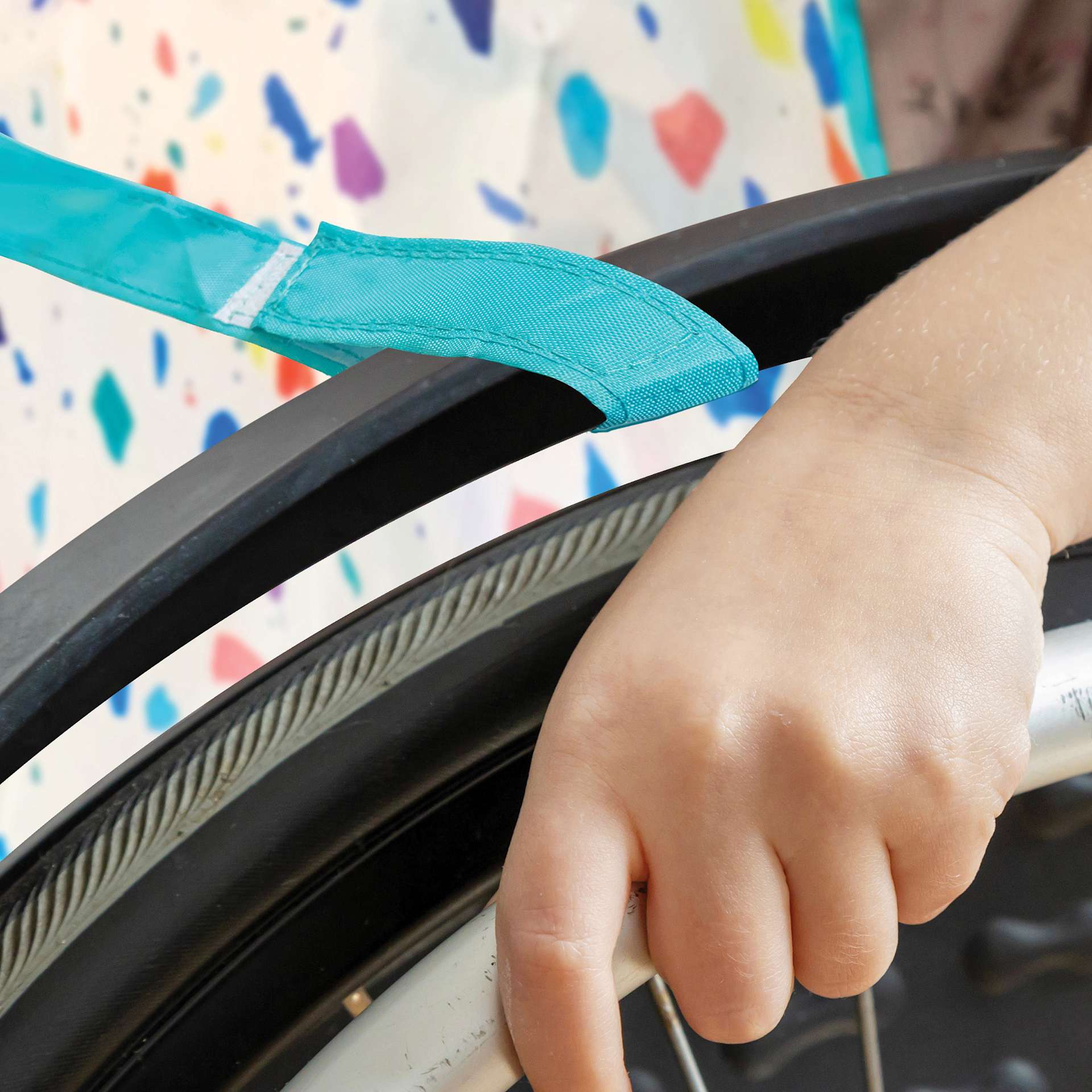 Kind Mind Adaptive Art Smock - adjustable strap attached to wheelchair