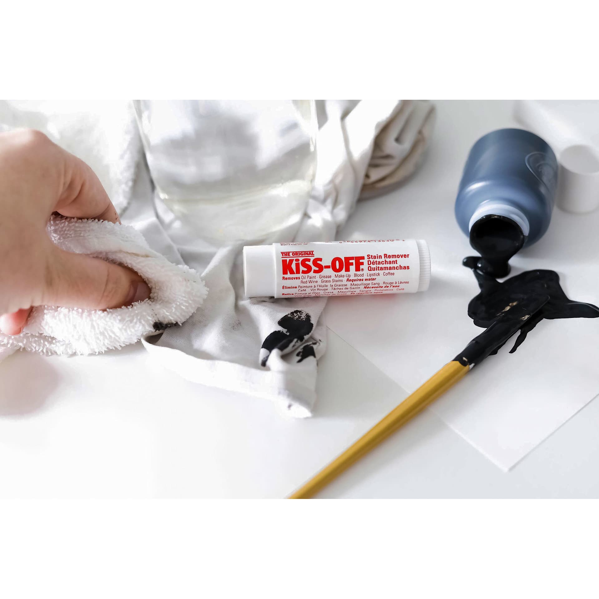 Kiss-Off Stain Remover - Being applied to remove paint on cloth Kiss-Off Stain Remover - Being applied to remove paint on cloth