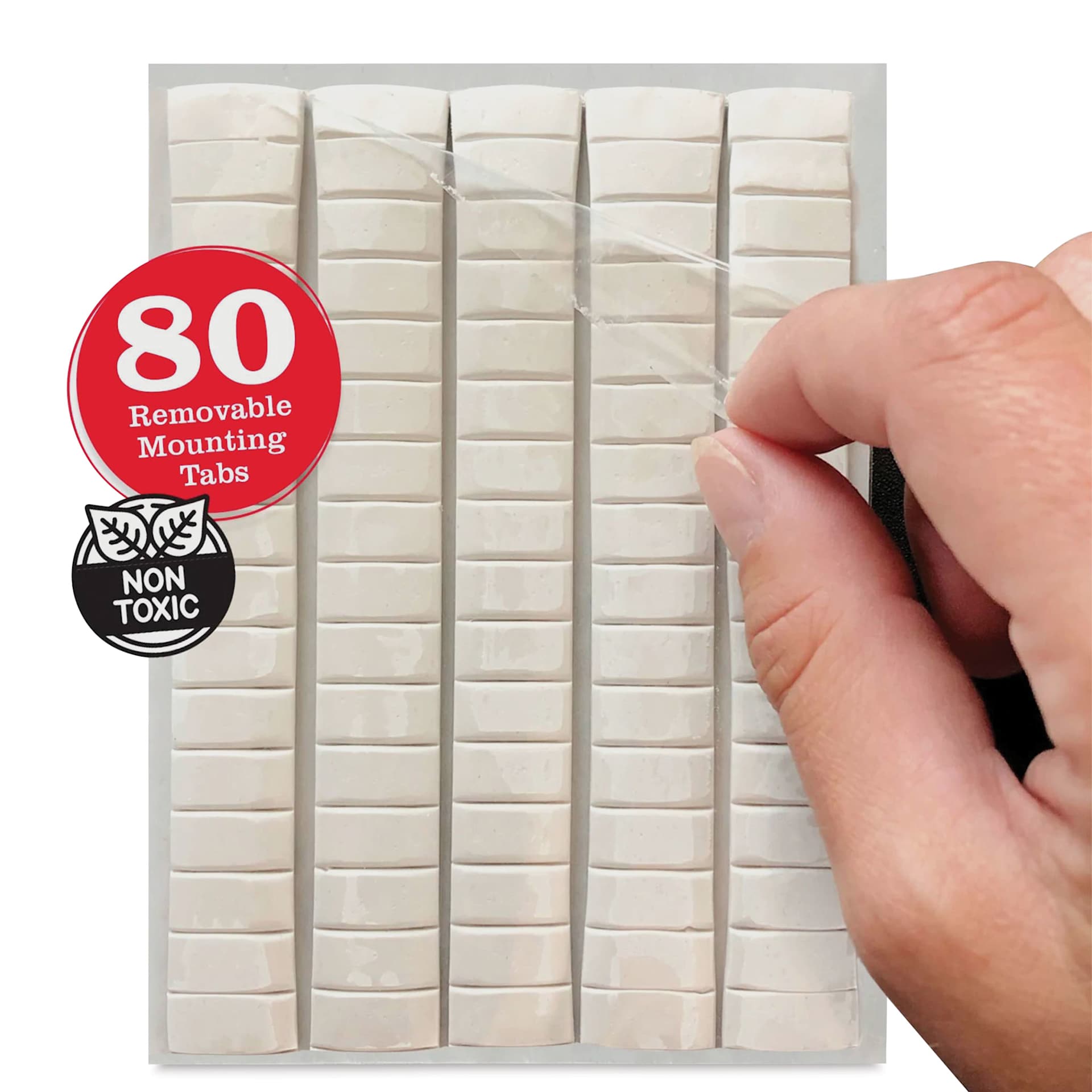 StikkiWorks StikkiTack Adhesive Putty - Pkg of 80, hand peeling off the protective cover from the tacks.