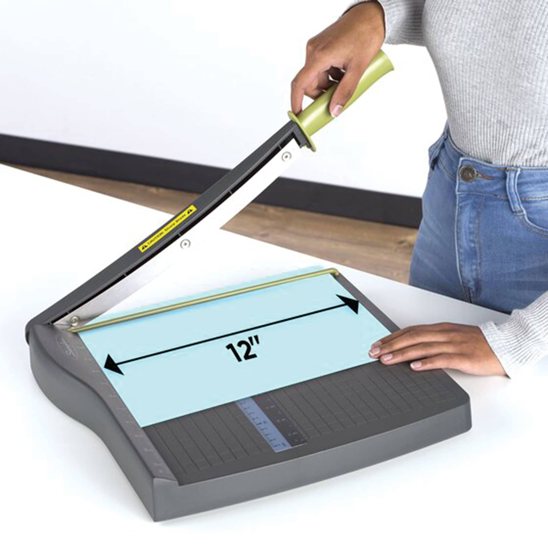 Swingline ClassicCut Lite Guillotine Trimmer - 12" being used to cut paper