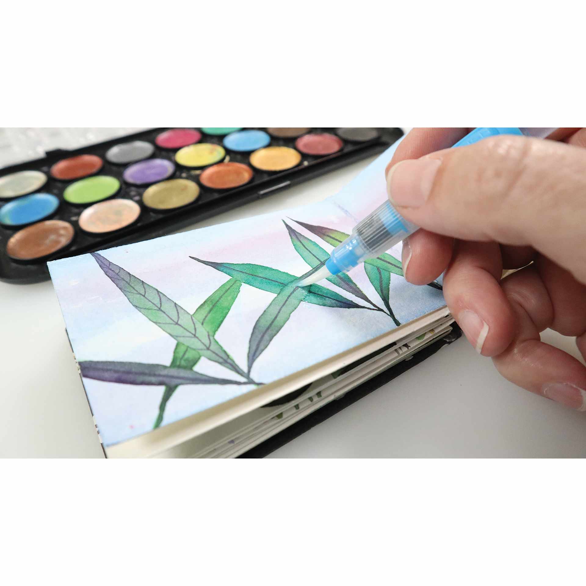 Niji Premier Waterbrush being used with watercolor pans Niji Premier Waterbrush being used with watercolor pans