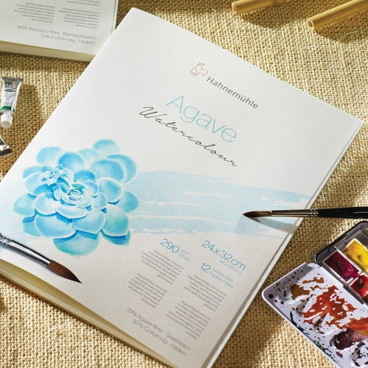 Hahnemühle Agave Watercolor Paper (shown with watercolor paints and brush)