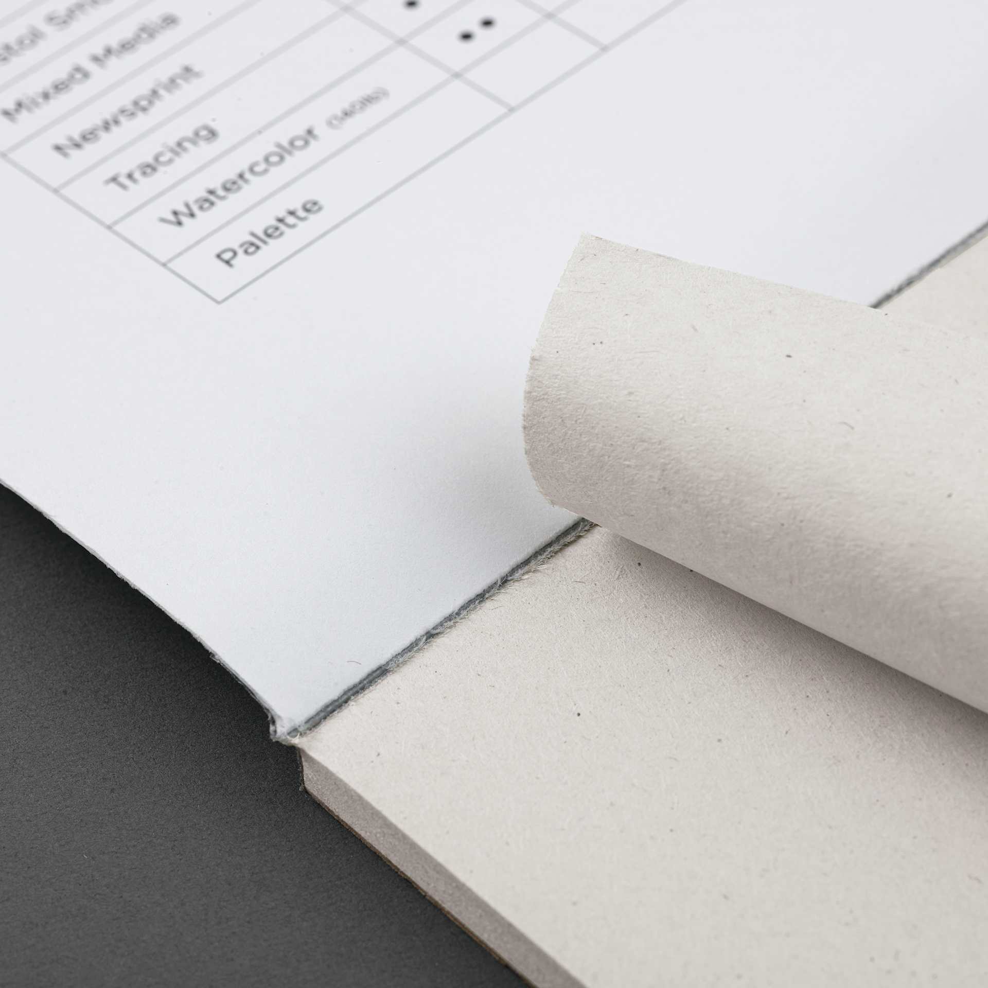 Blick Studio Newsprint Pad - 18" x 24", 50 Sheets, sheet being torn from pad