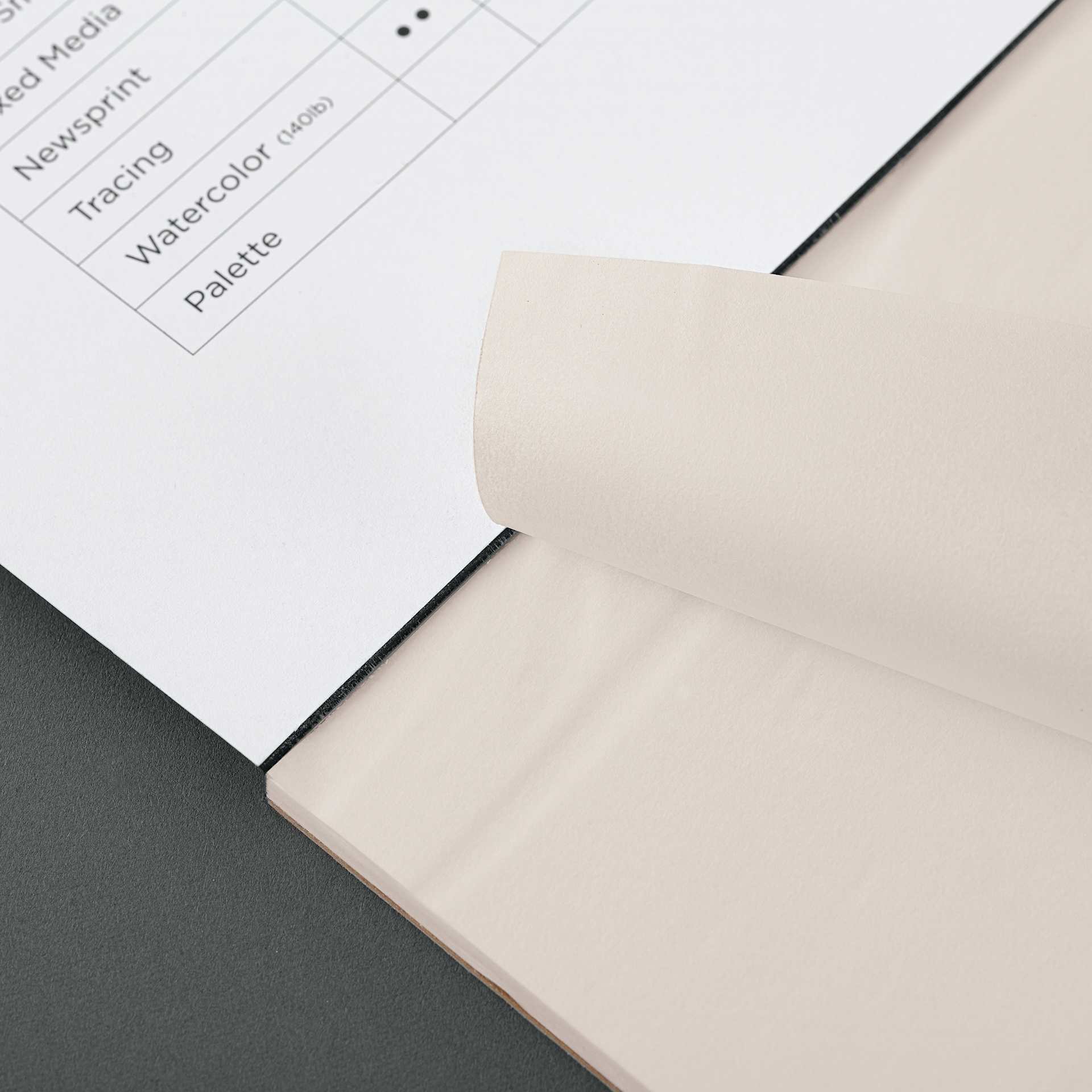 Blick Studio Tracing Paper Pad - 11" x 14", 50 Sheets, sheet being torn from pad