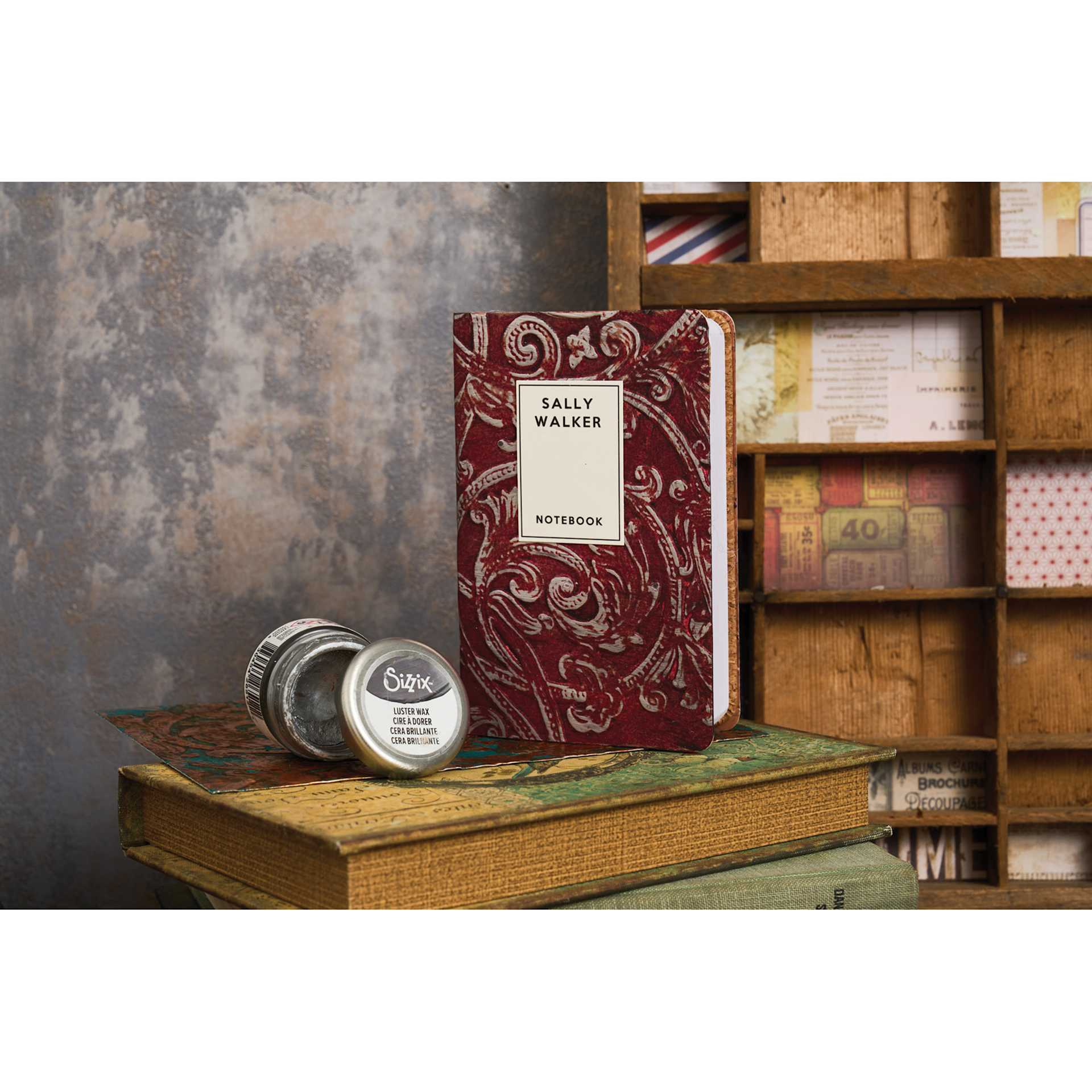 Sizzix 3-D Texture Fades Embossing Folder - Entangled applied to book cover sitting beside Sizzix Luster Wax (sold seperately)