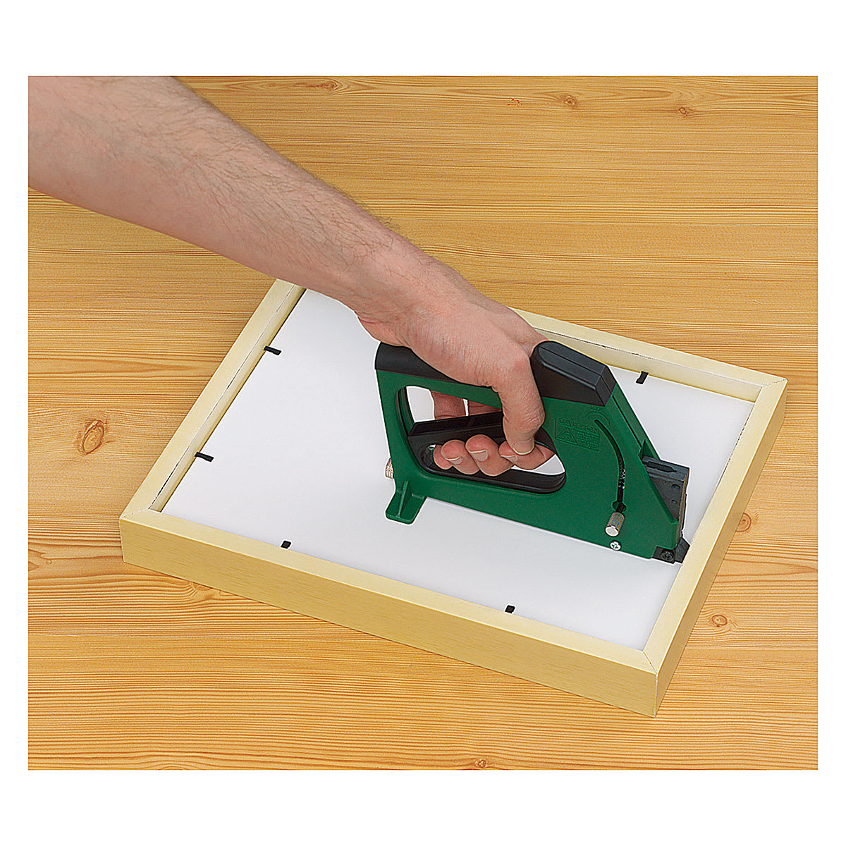 Fletcher FlexiMaster Framing Tool - Hand using tool to fire points into frame