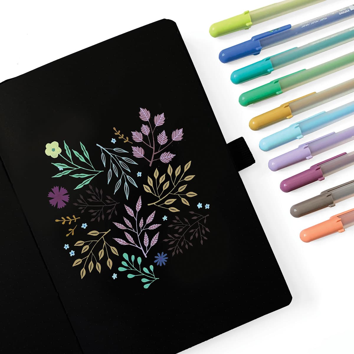 Sakura Gelly Roll Moonlight Pens - Set of 10 Pastel colors shown next to decorated black Journal