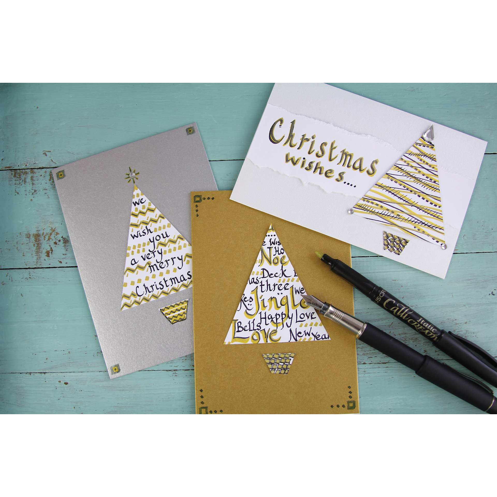 Manuscript CalliCreative Italic Marker - Gold and Silver markers over Christmas themed cards Manuscript CalliCreative Italic Marker - Gold and Silver markers over Christmas themed cards