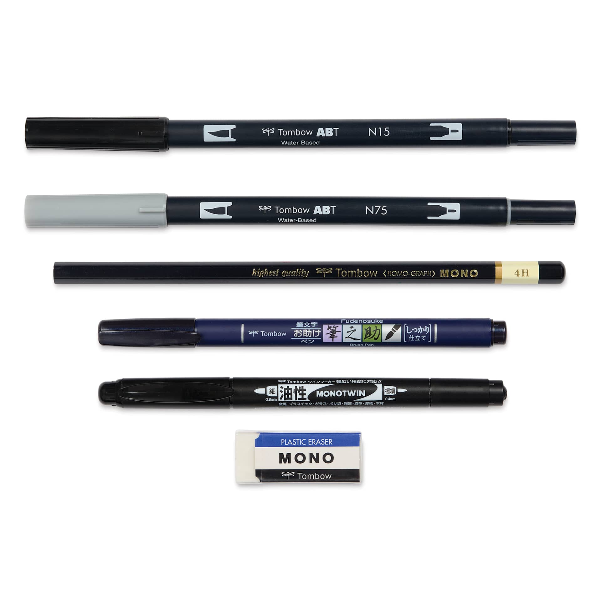 Tombow Lettering Basics Set, pens and markers with caps on, laid outside of the packaging