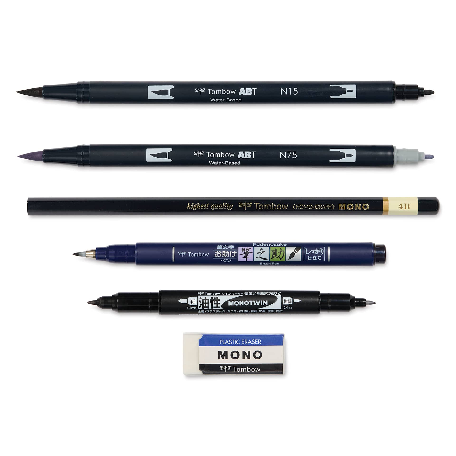Tombow Lettering Basics Set, pens and markers with caps off, laid outside of the packaging