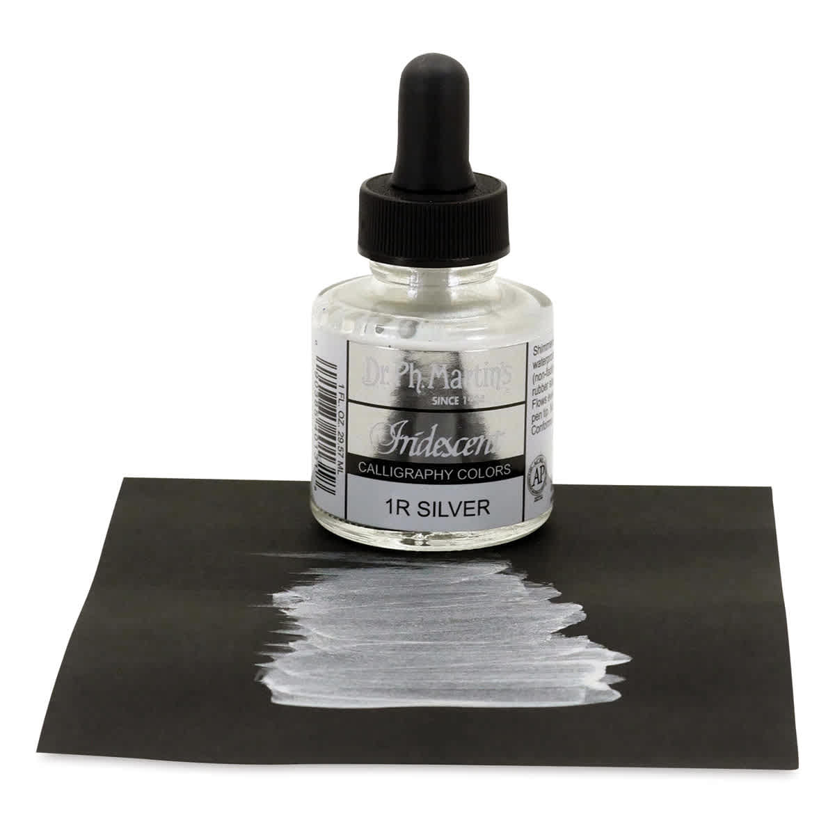 Dr. Ph. Martin's Iridescent Calligraphy Ink - 1 0z Silver bottle on paper with swath of ink Dr. Ph. Martin's Iridescent Calligraphy Ink - 1 0z Silver bottle on paper with swath of ink
