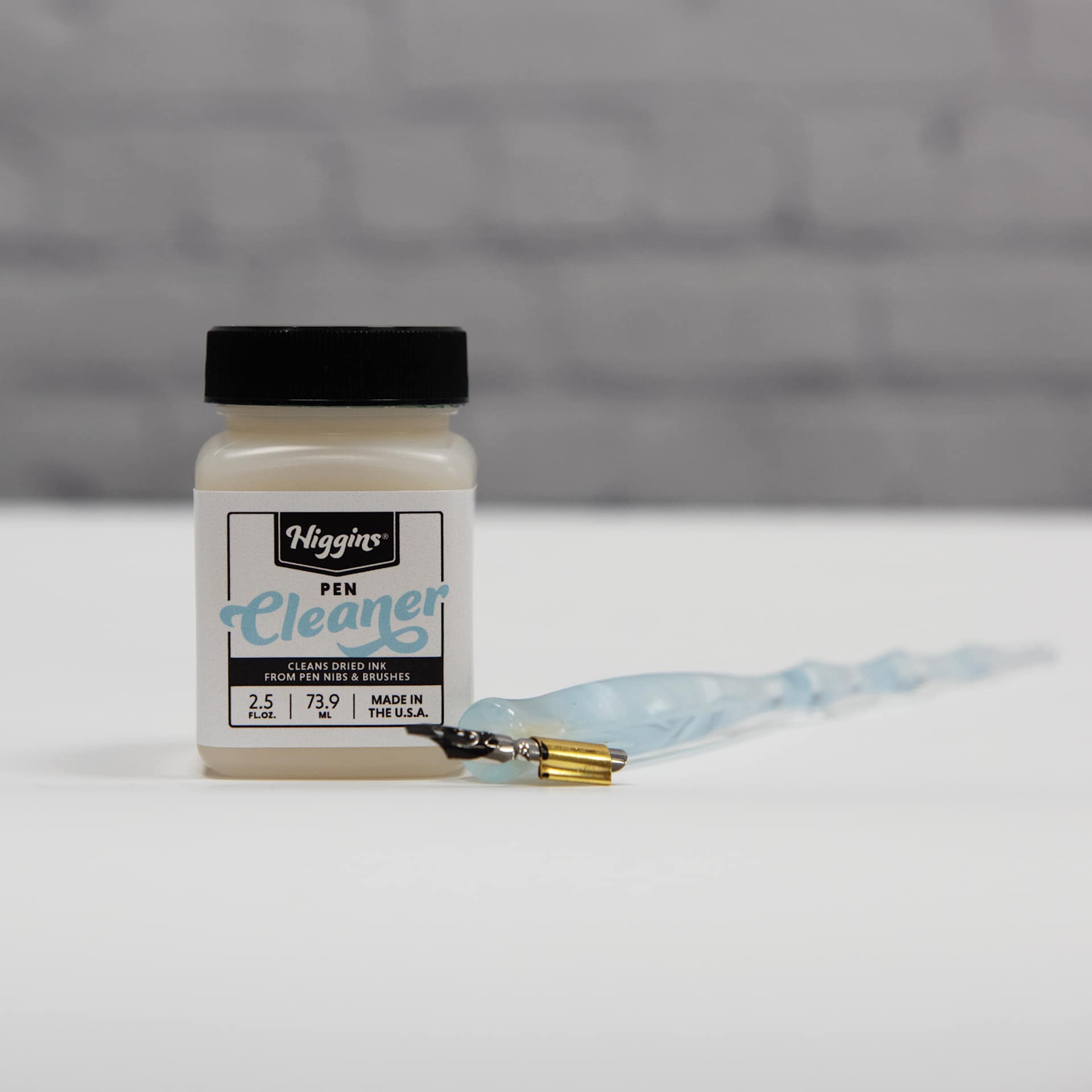 Higgins Pen Cleaner jar and tip pen.
