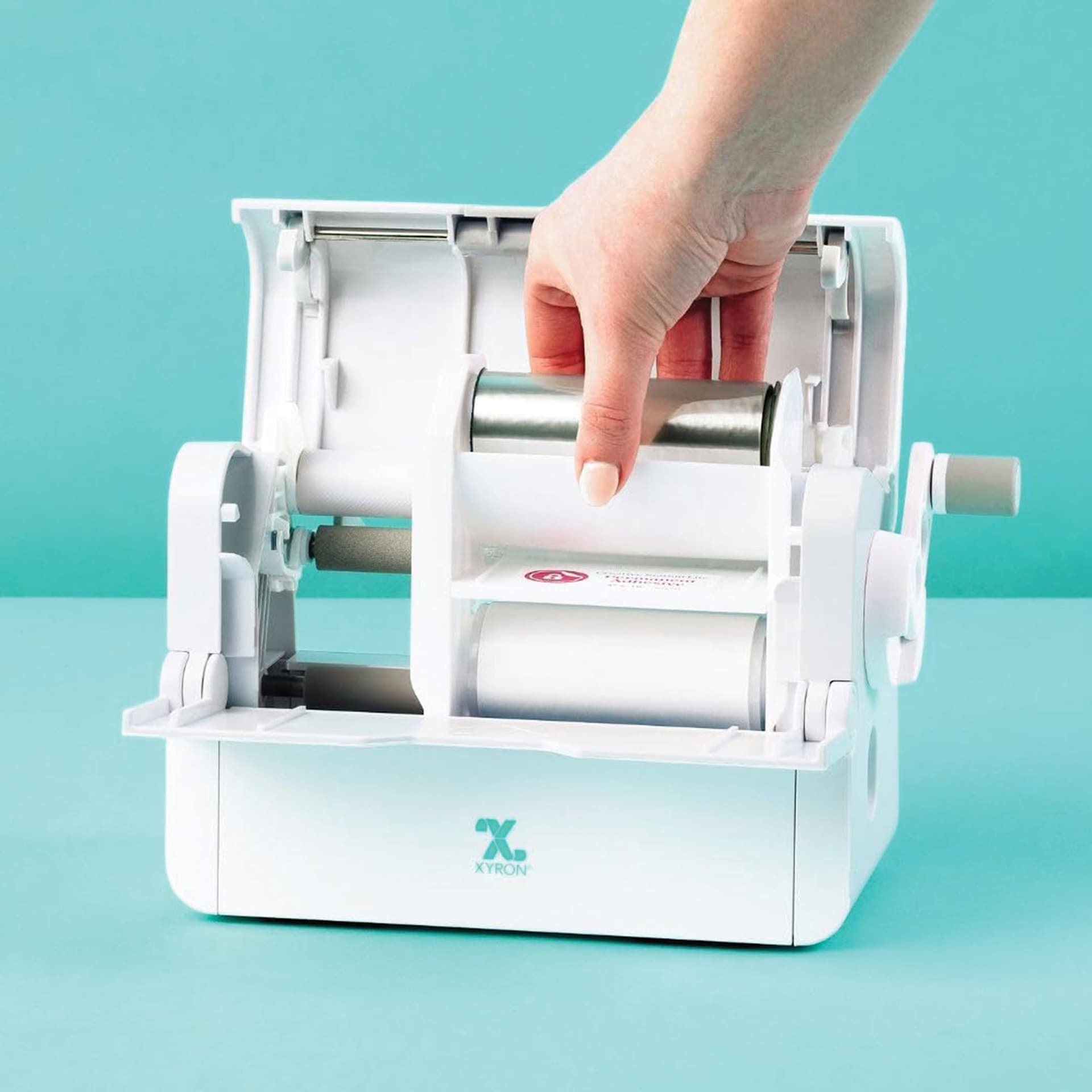 Xyron Creative Station Lite Multi-Use Applicator opened on table top