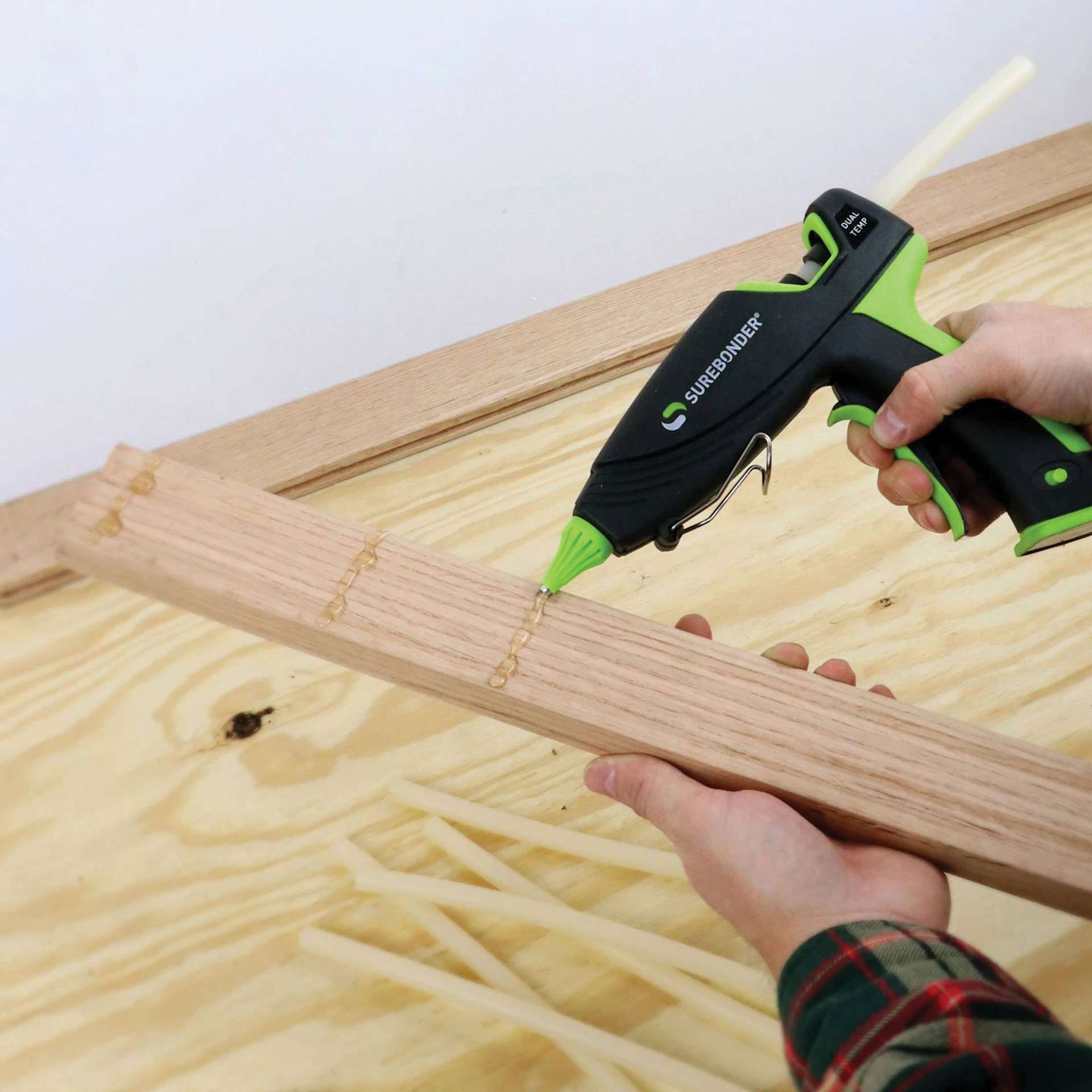 Surebonder Ultra Series Dual Temp Glue Gun - 100 Watt, in hand applying glue onto wood