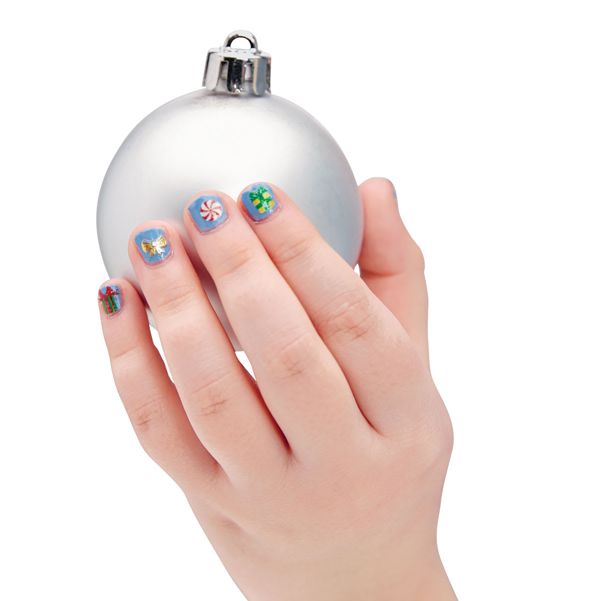 Holiday Nail Art Mini Kit - Child's hand with Stickers on nails holding clear tree ornament