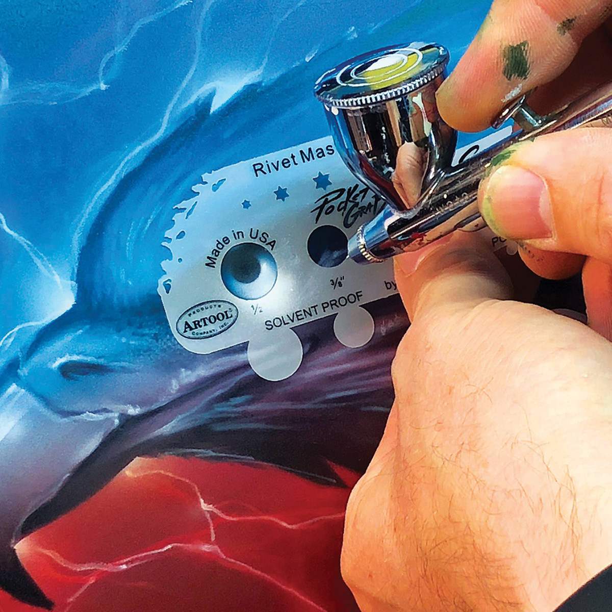 PocketGraFX Freehand Template Set - Artist using template to airbrush design on painting