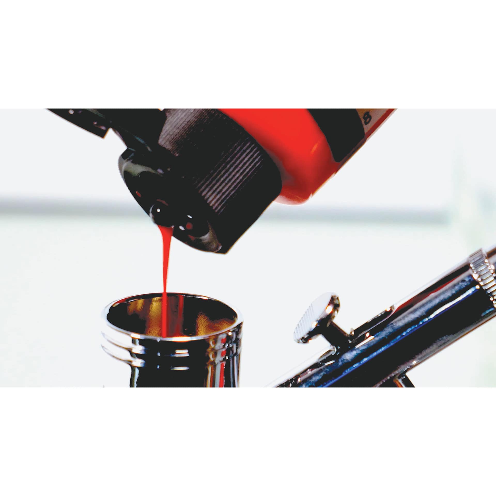 Intro to Airbrush Kit, close-up of airbrush reservoir being filled