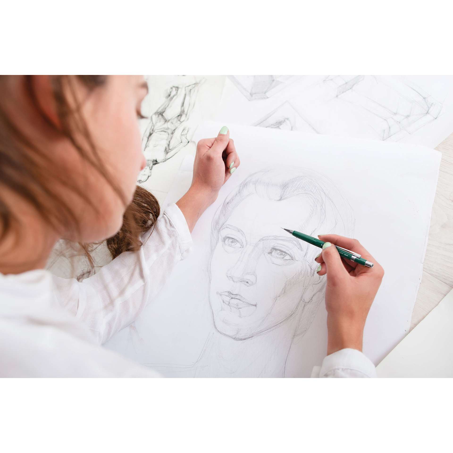 Blick Essentials Mechanical Pencil - Green, 0.3 mm (girl drawing a face with the pencil)