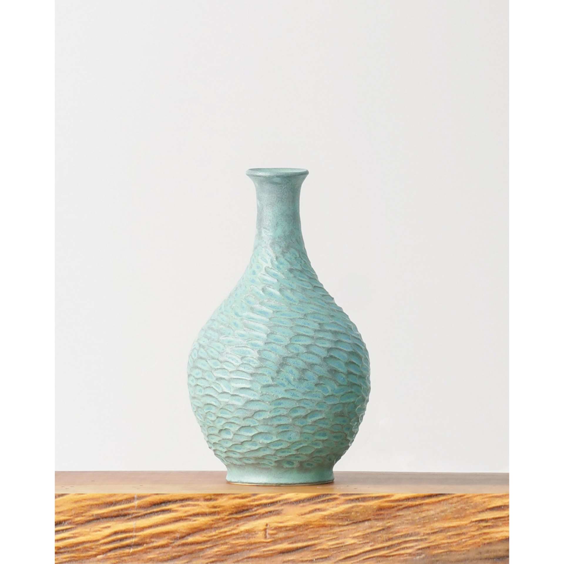 Blue Stone Amaco Potter's Choice Glaze applied to a vase.