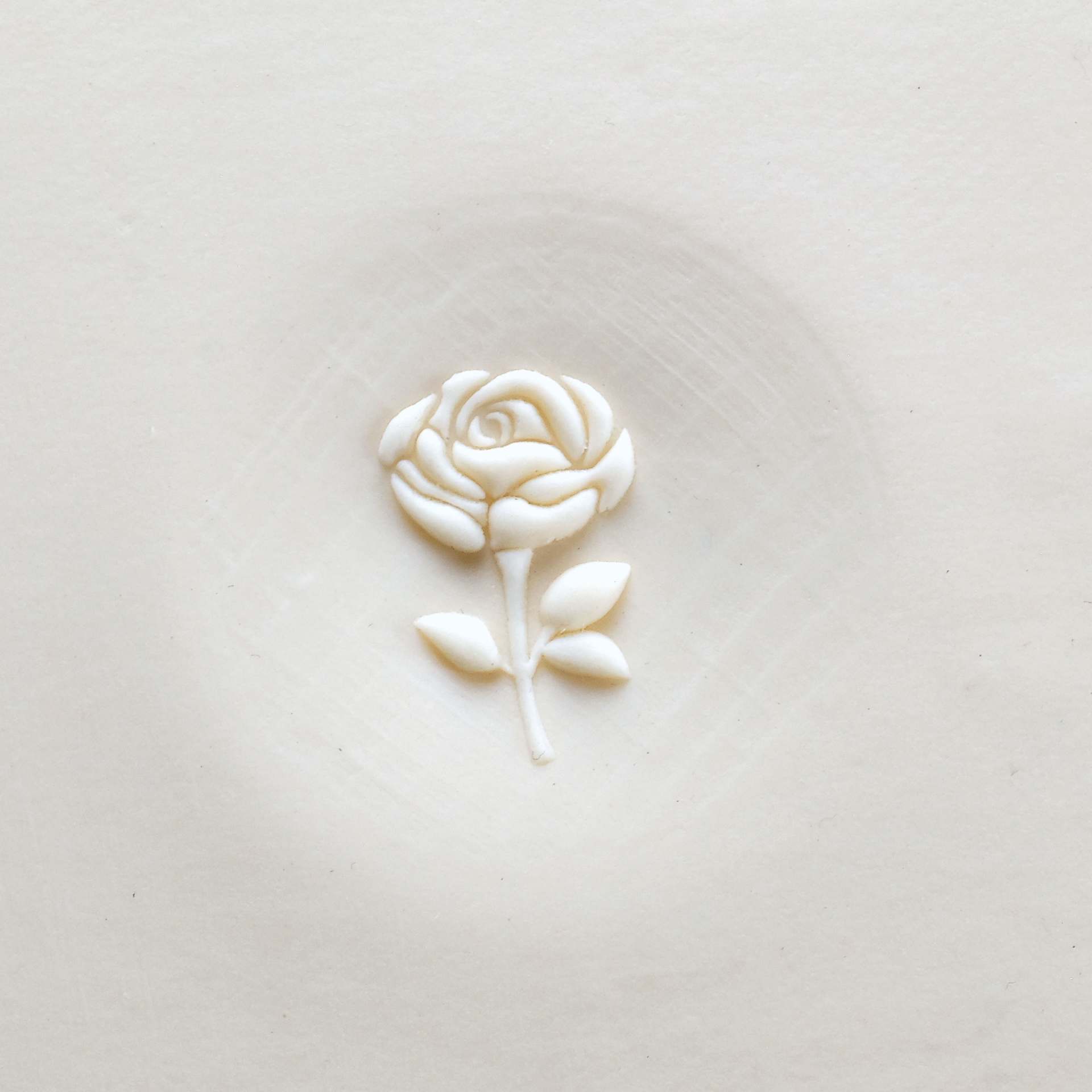 MKM Pottery Tools Curve Top Stamp - Rose with Stem applied to clay