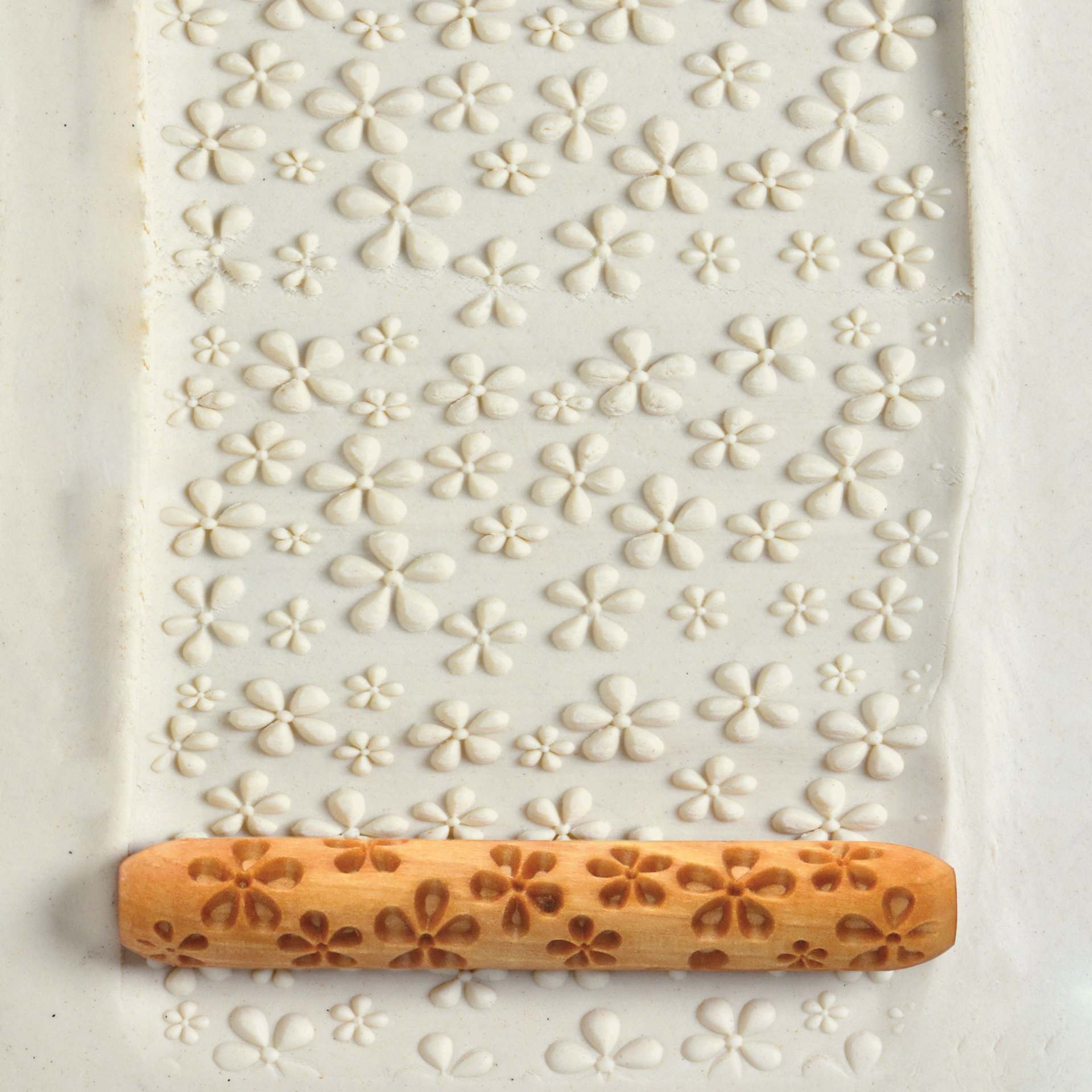 MKM Pottery Tools Hand Roller - Daisy applied to clay