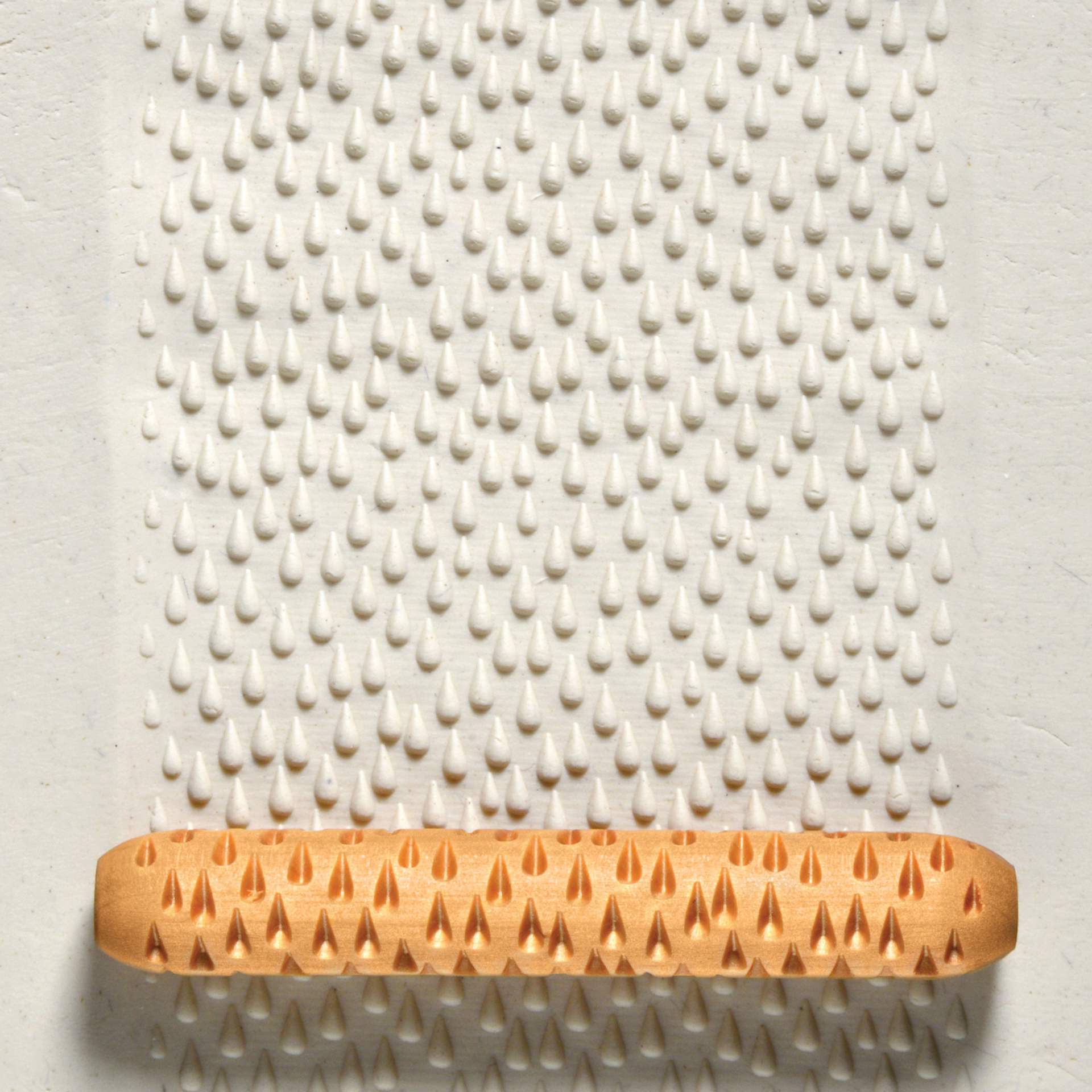 MKM Pottery Tools Hand Roller - Rain applied to clay