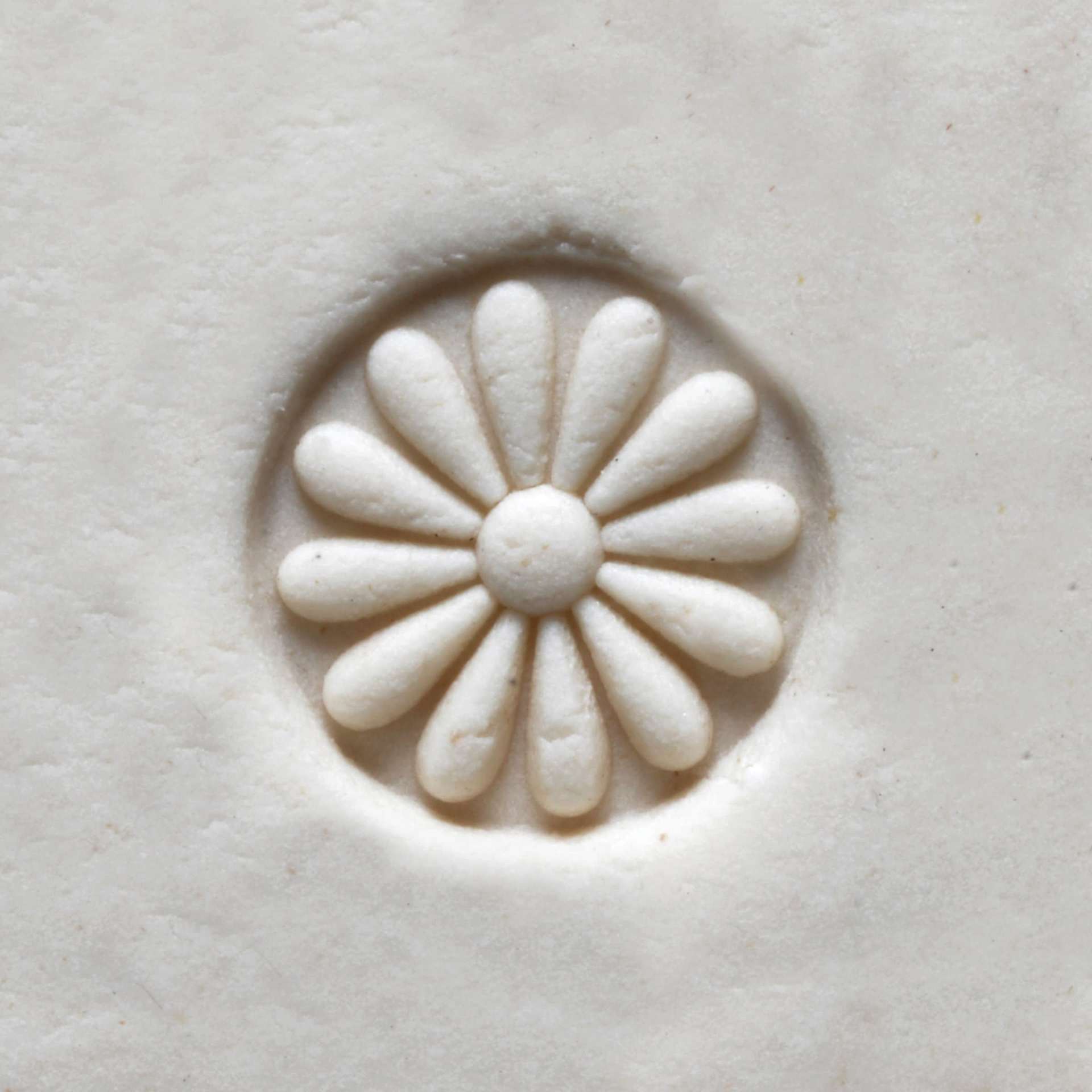 MKM Pottery Tools Small Round Stamp - SCS-003, Debossed Daisy applied to clay