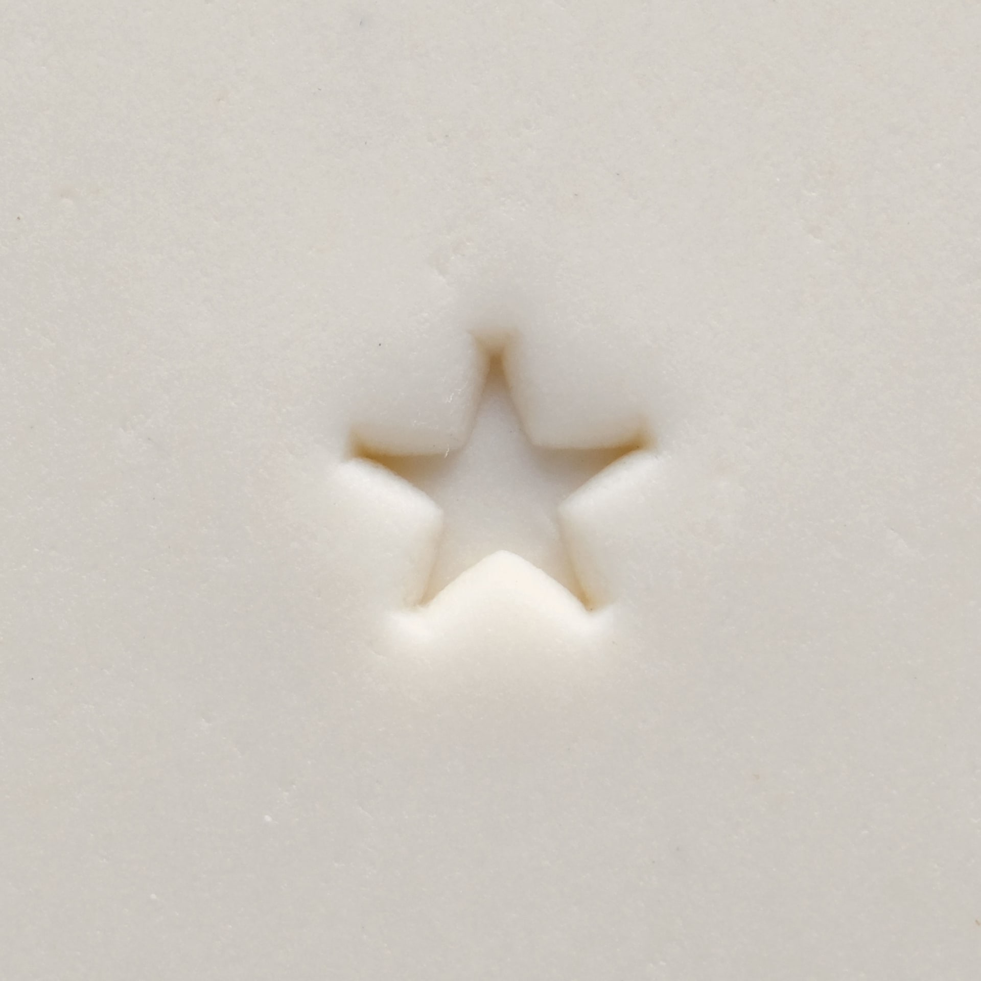 MKM Pottery Tools Mini Round Stamp - Texas Star applied to clay