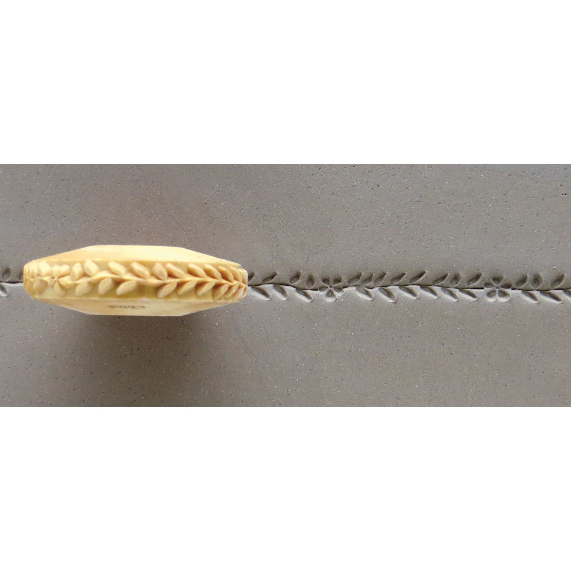 MKM Pottery Tools Finger Roller - Vine with Leaves and Flowers applied to clay