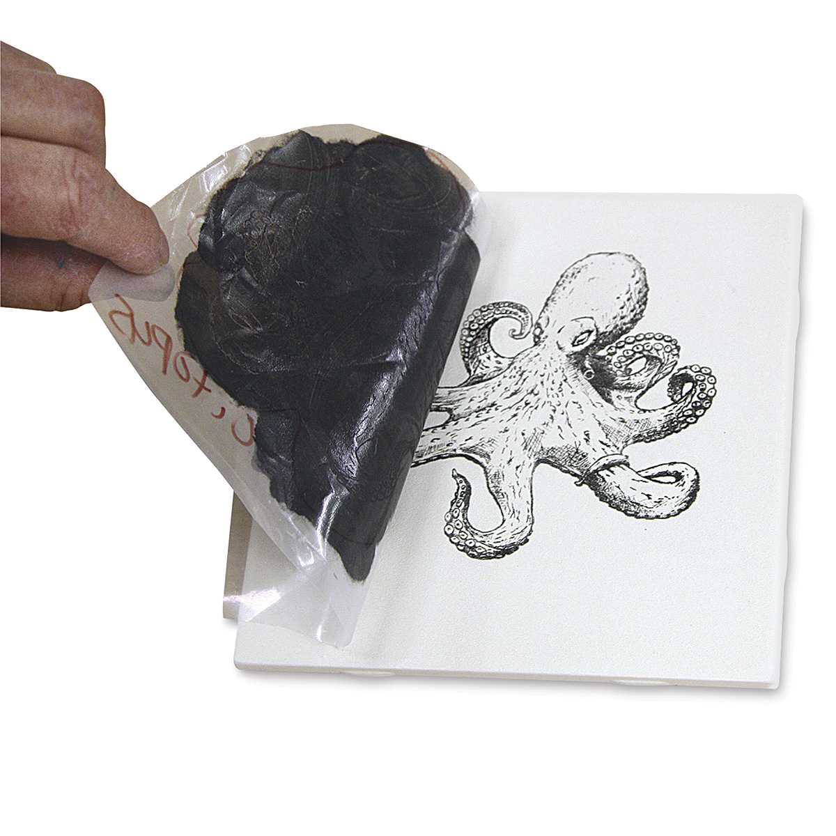 Mayco Designer Silkscreens - Artist's hand applying glaze to Octopus screen