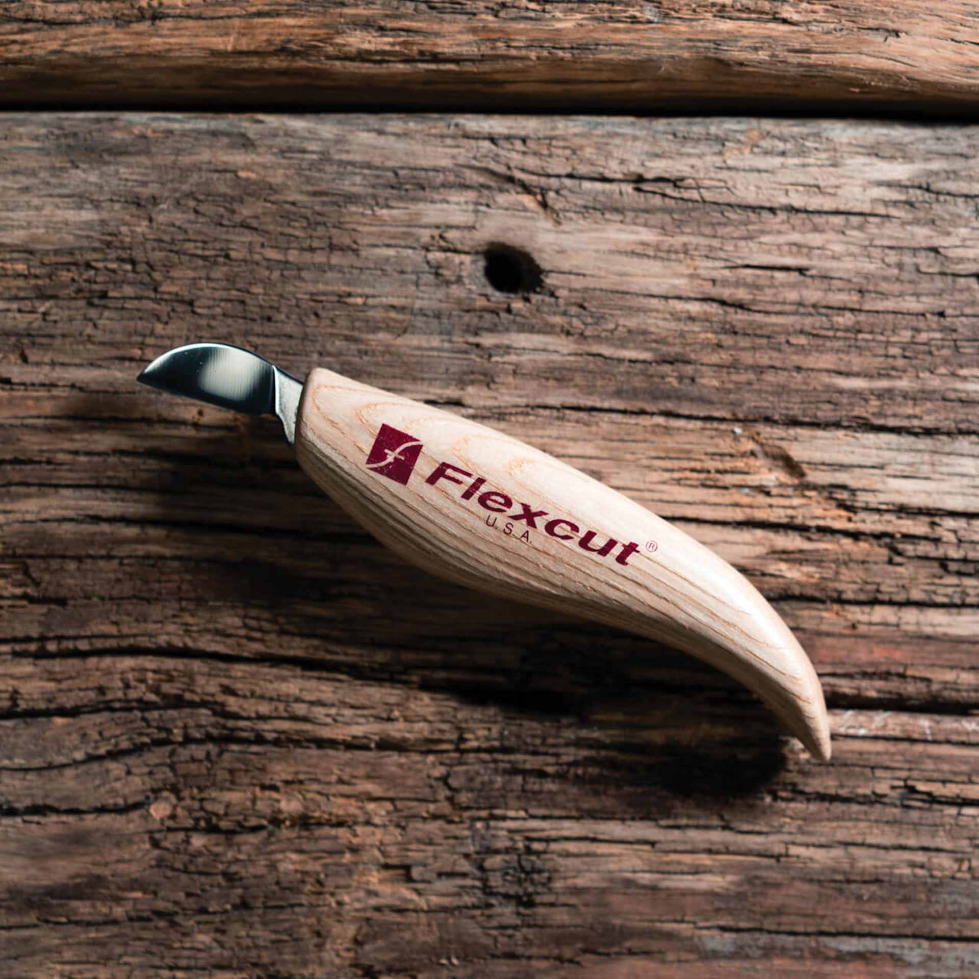 Flexcut Chip Carving Knife laying on wooden table