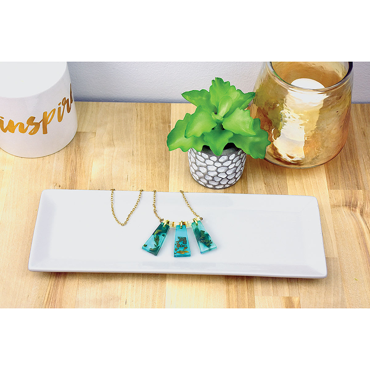 Liquid Sculpey - Pendant Necklace made with Liquid Sculpey displayed on ceramic tray