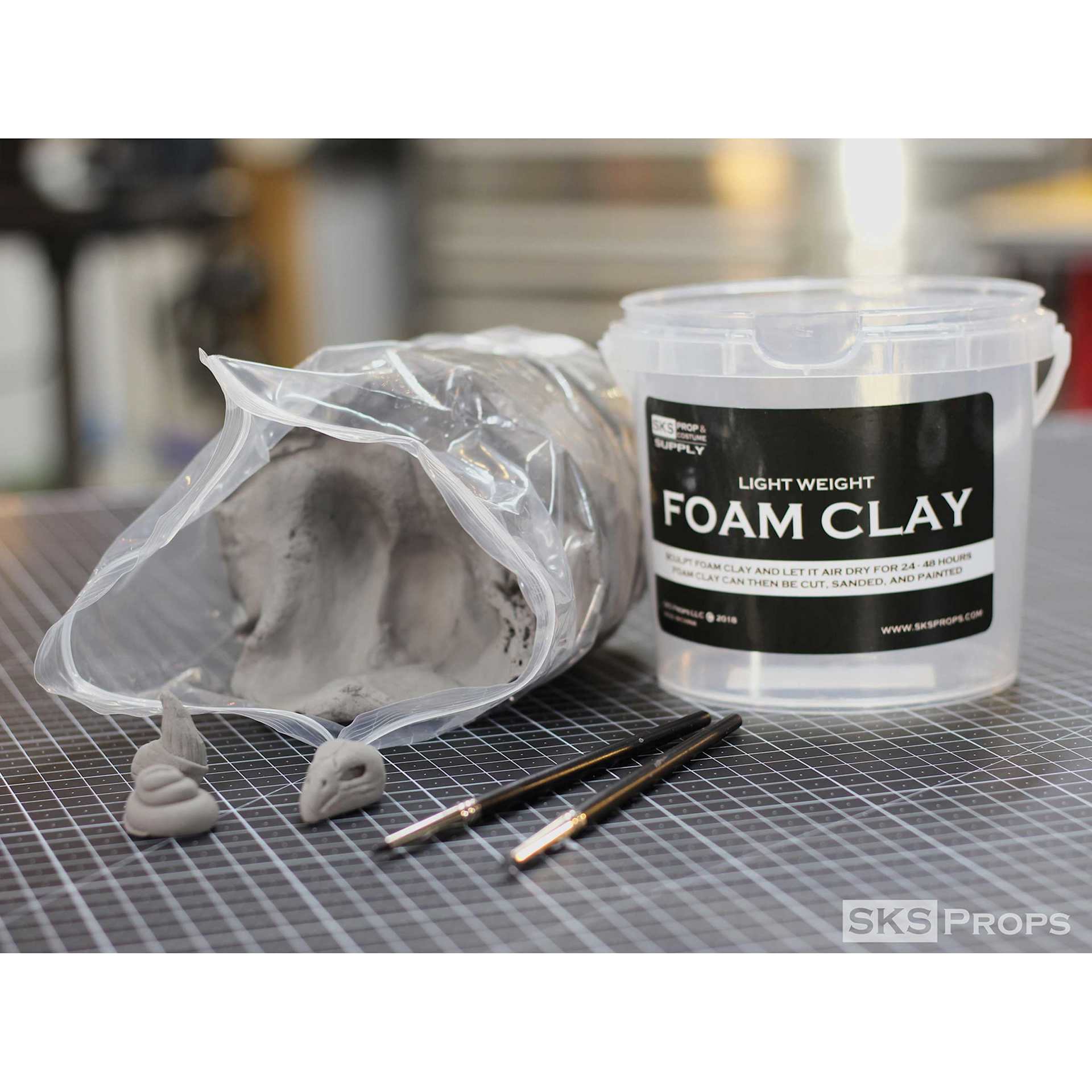 SKS Props Lightweight Foam Clay - 300 g Bucket showing packaging beside opened contents (shown clay tools sold separately)