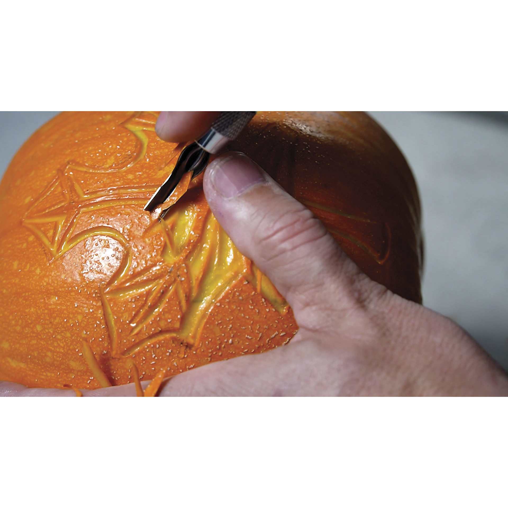 Speedball Linoleum Cutter Sets and Replacement Blades, pumpkin being carved Speedball Linoleum Cutter Sets and Replacement Blades, pumpkin being carved