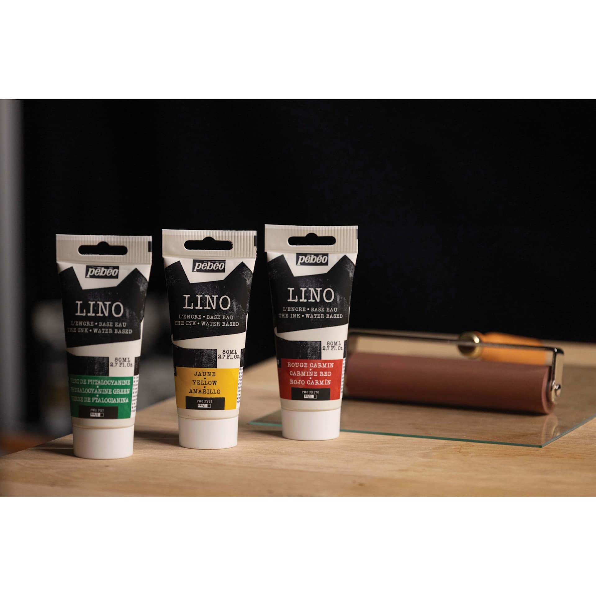 Pebeo Lino Inks beside brayer and glass plate