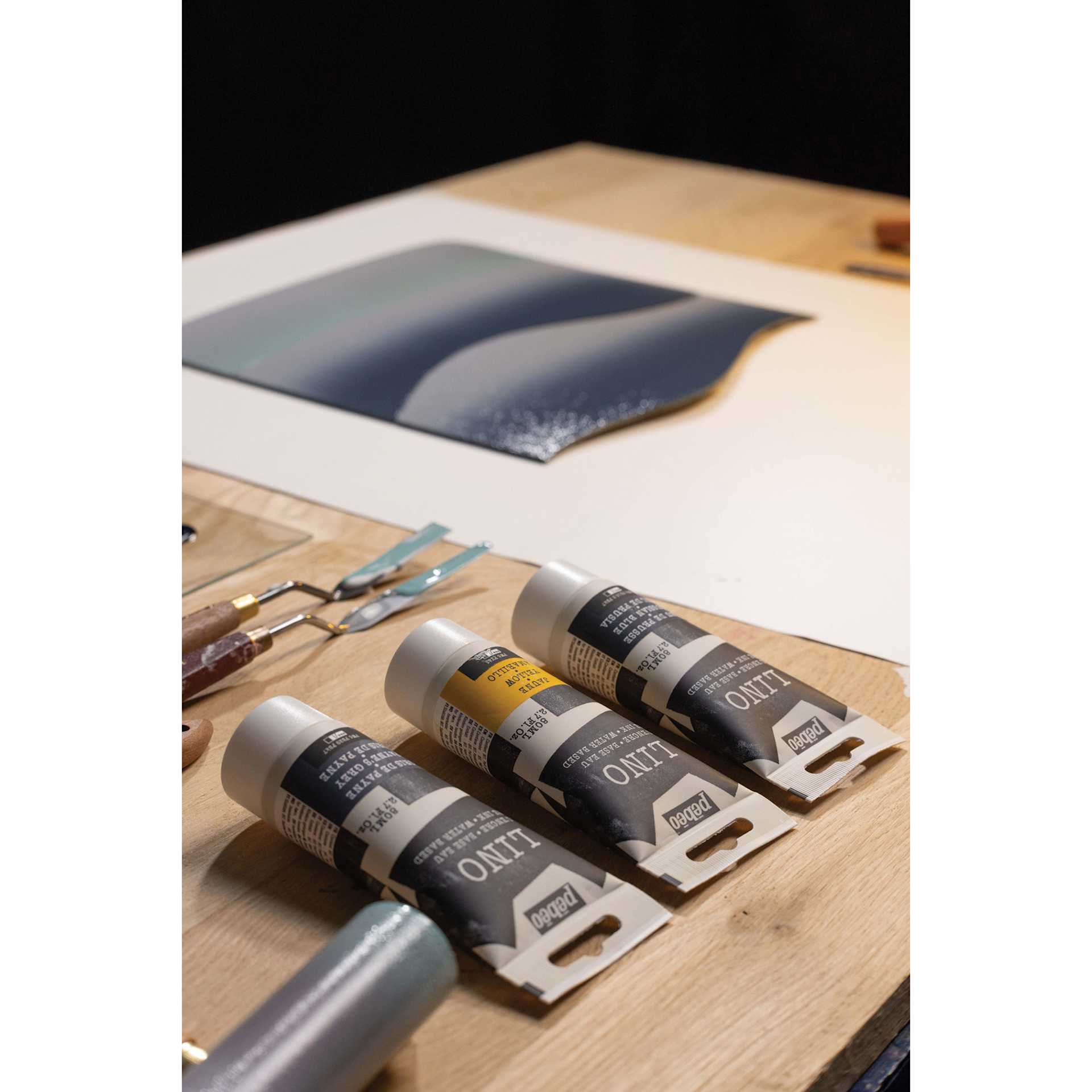 Pebeo Lino Inks sitting beside brayers and and in-grogress project