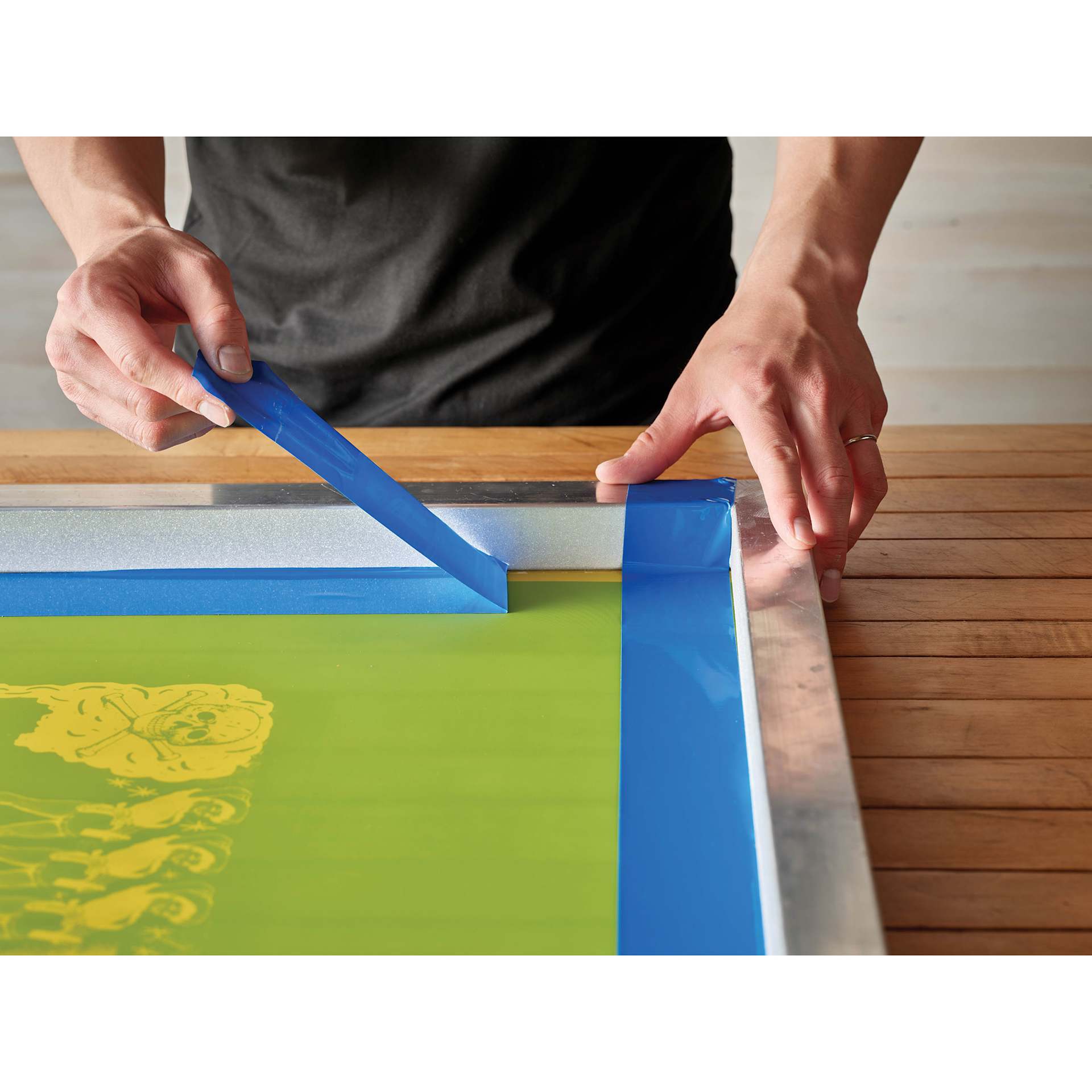 Speedball Block Out Tape - 2" x 36 yd being removed from screen