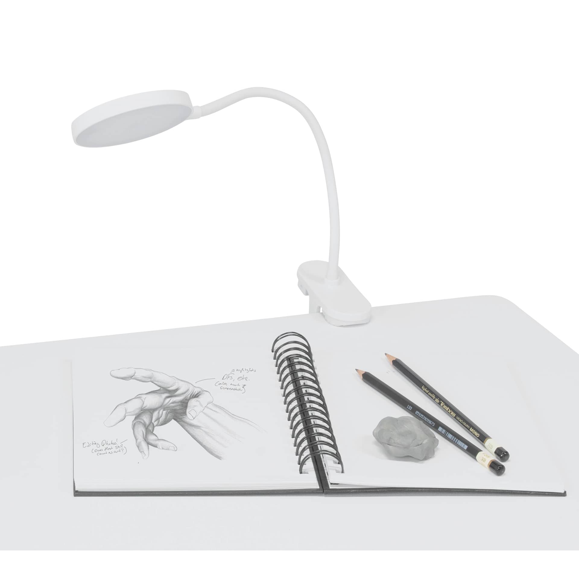Artograph LED Dot Clip-On Lamp, clipped to a drawing table